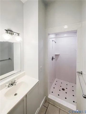 a bathroom with a sink a vanity and a mirror