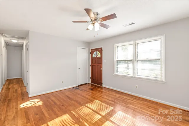 a view of a big room with wooden floor and closet