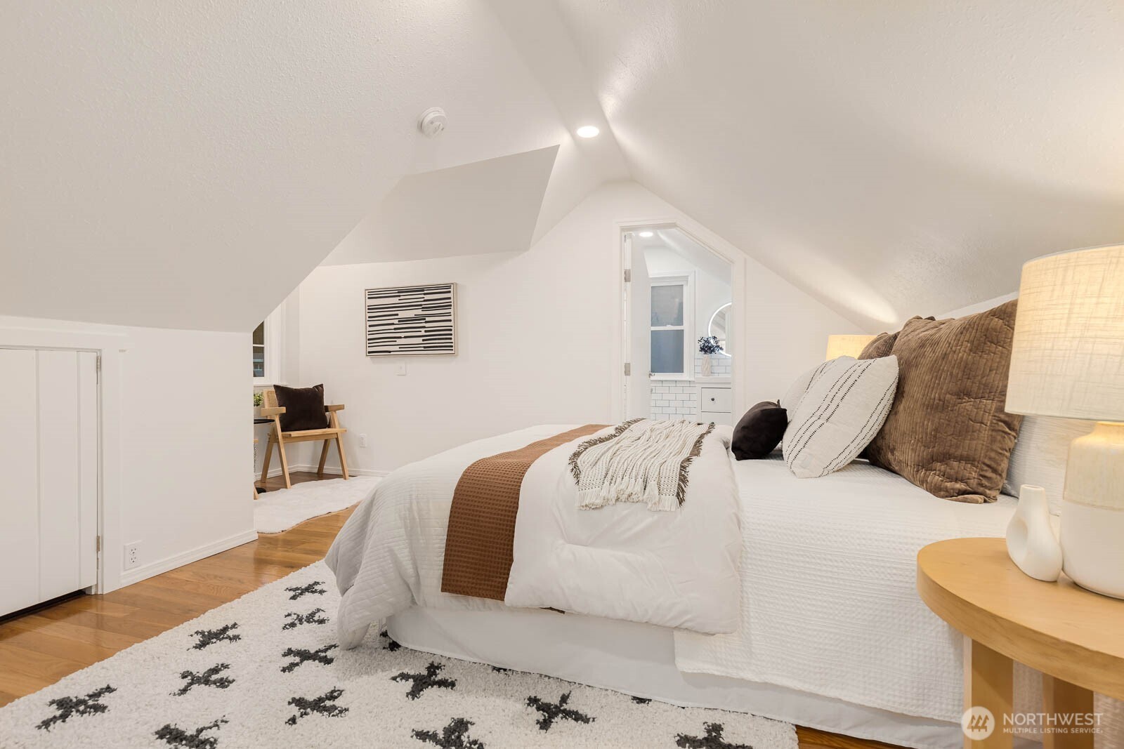 17110 66th Place West Edmonds, WA 98026 - Photo 14 of 38 a large white bed in a white room