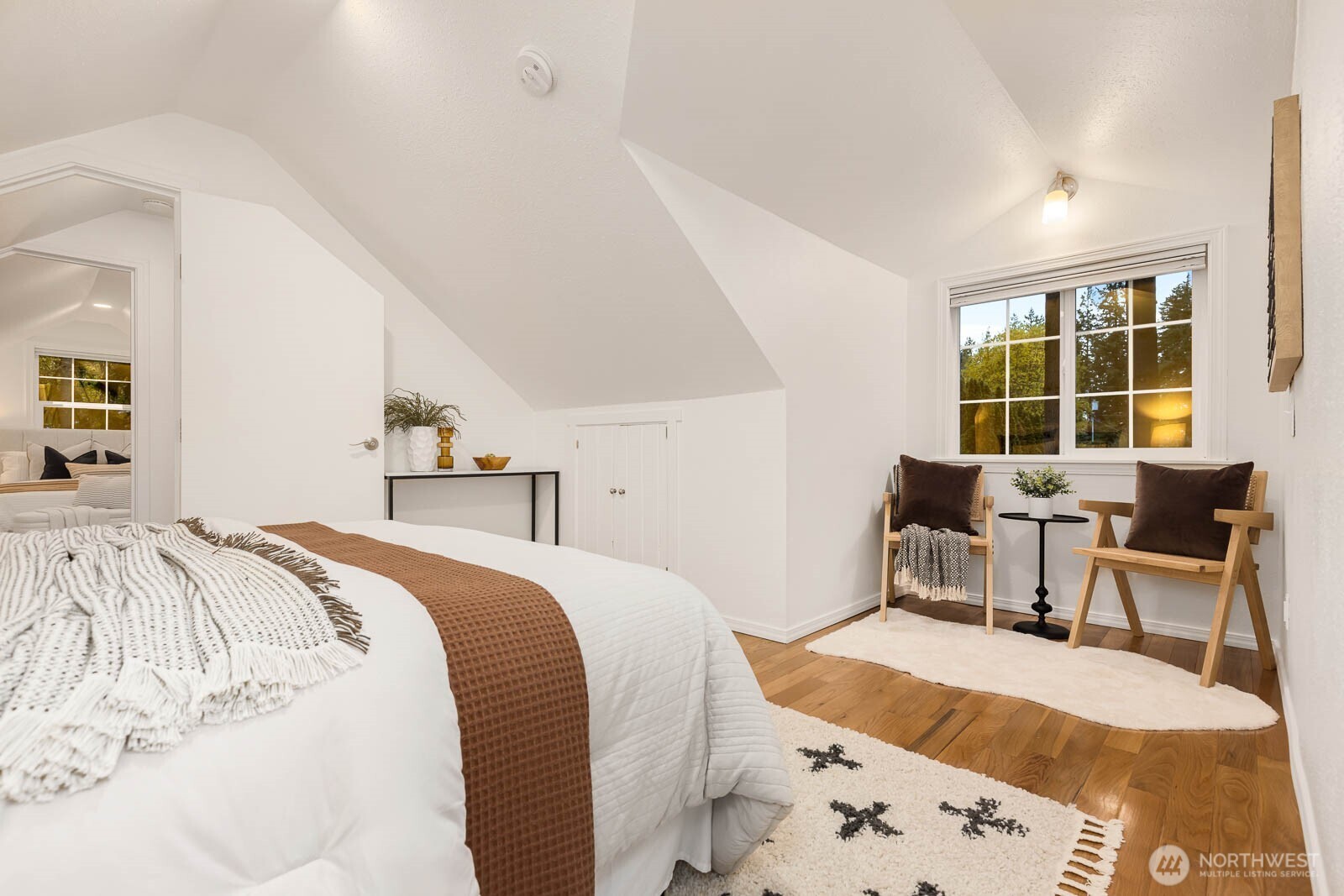 17110 66th Place West Edmonds, WA 98026 - Photo 15 of 38 a bed room with a bed and a chair