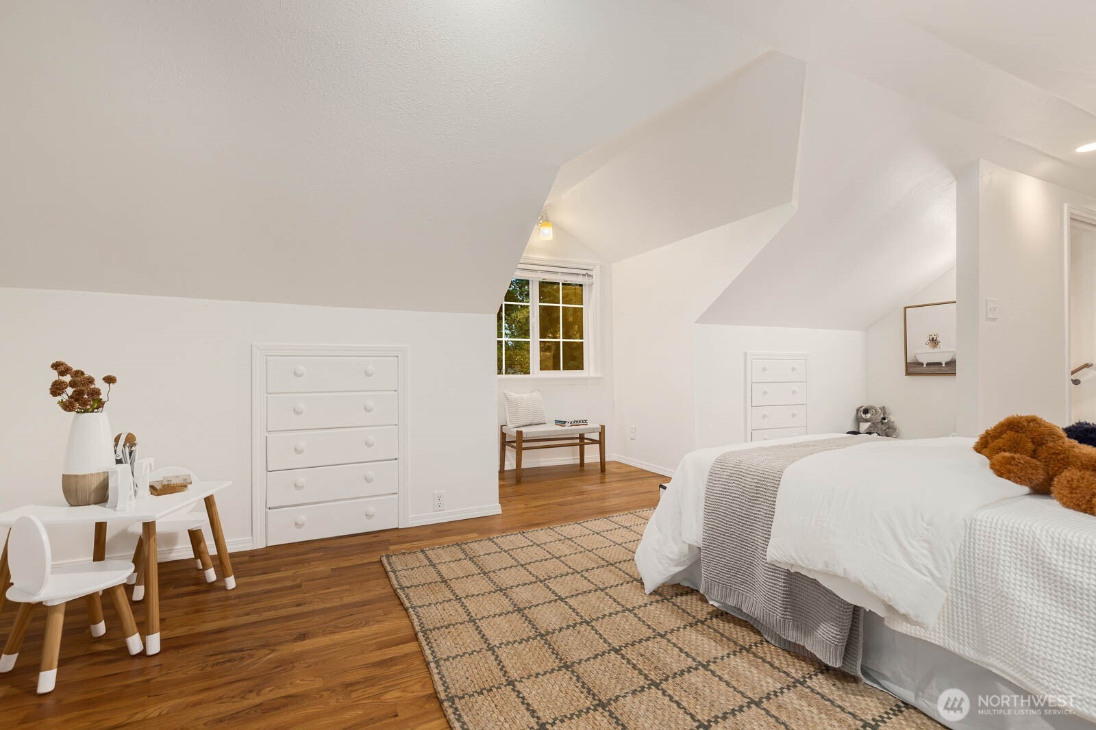 17110 66th Place West Edmonds, WA 98026 - Photo 21 of 38 a bedroom with a bed and chair