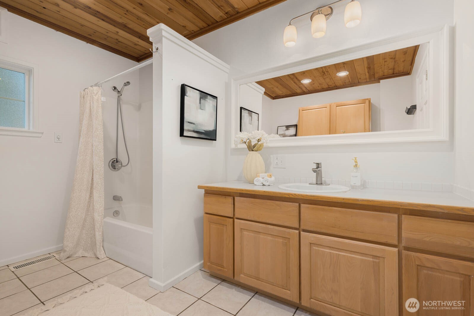 17110 66th Place West Edmonds, WA 98026 - Photo 23 of 38 a bathroom with a shower a sink and a mirror