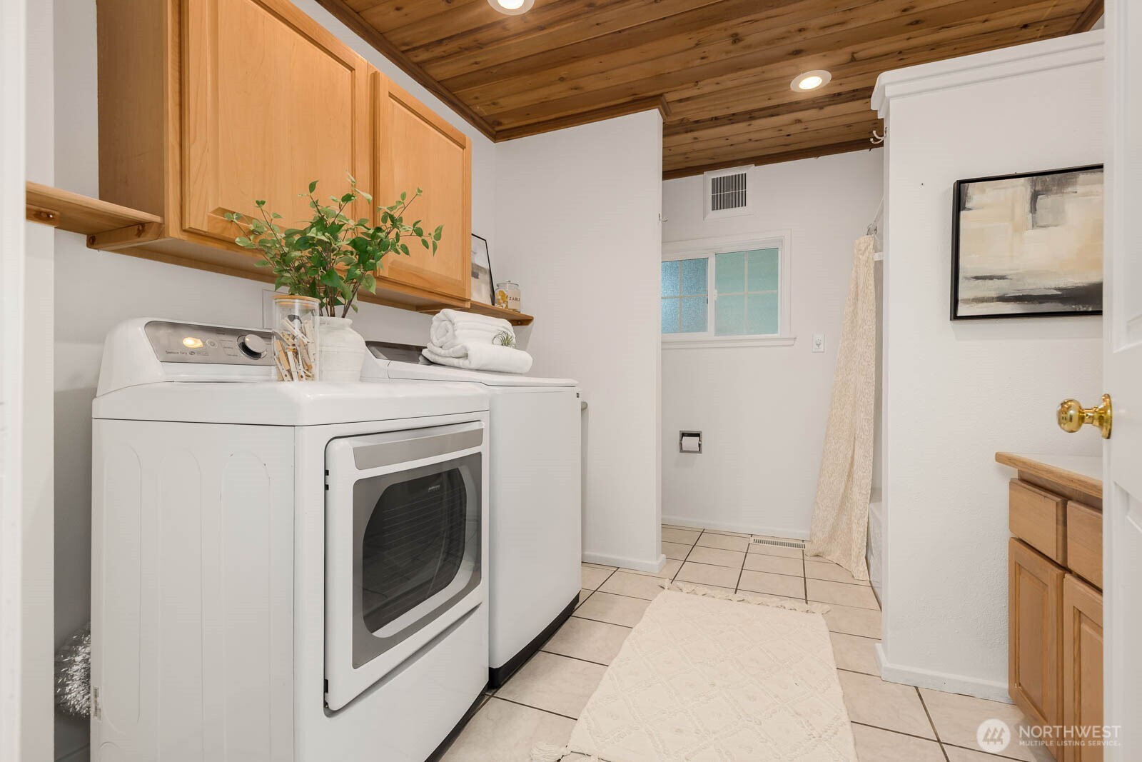 17110 66th Place West Edmonds, WA 98026 - Photo 24 of 38 a view of a hallway with washer and dryer