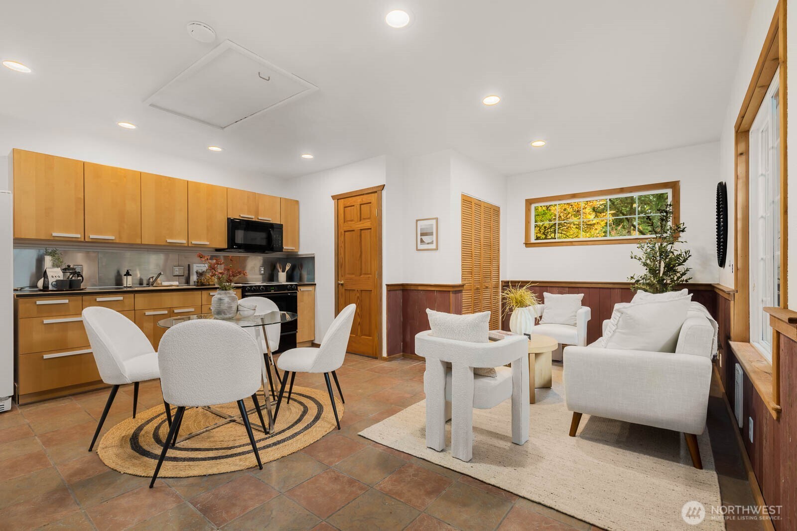17110 66th Place West Edmonds, WA 98026 - Photo 28 of 38 a living room with furniture and kitchen view