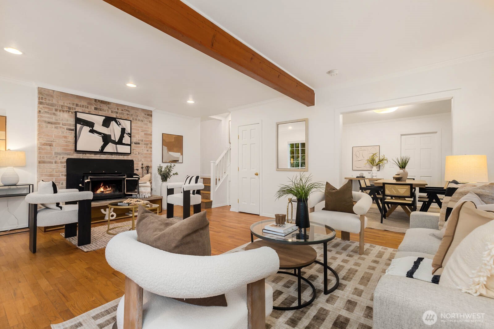 17110 66th Place West Edmonds, WA 98026 - Photo 4 of 38 a living room with furniture a fireplace and a flat screen tv