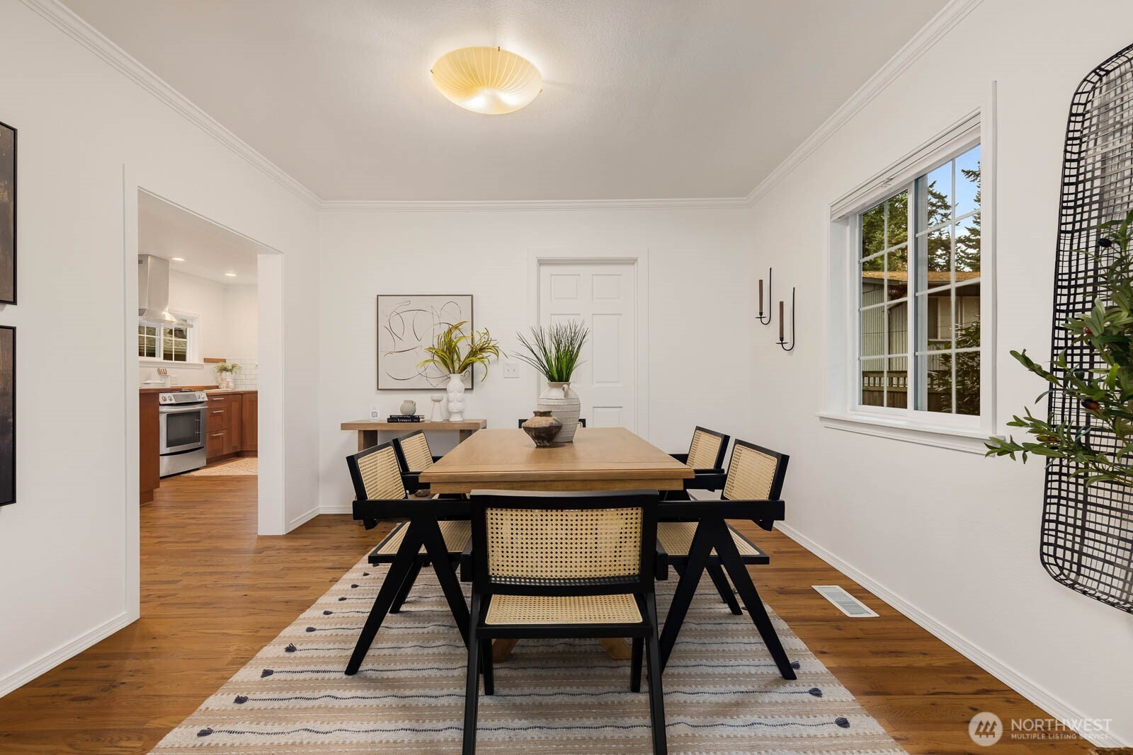 17110 66th Place West Edmonds, WA 98026 - Photo 8 of 38 a view of a dining room with furniture and wooden floor