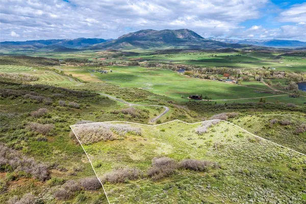 a view of an ocean and a mountain