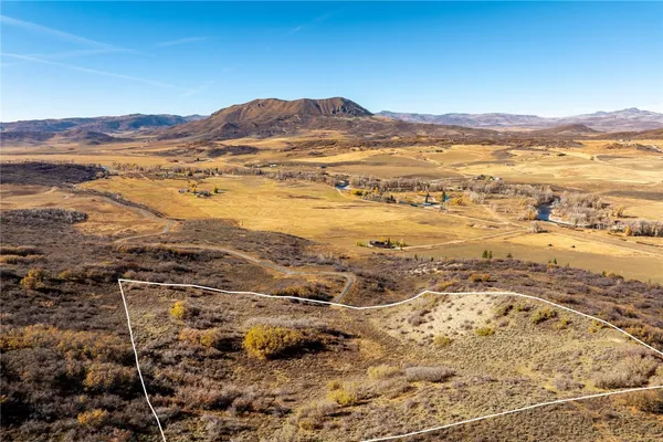 a view of an ocean and a mountain