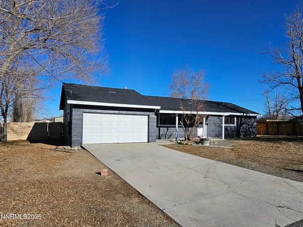 a front view of a house with yard