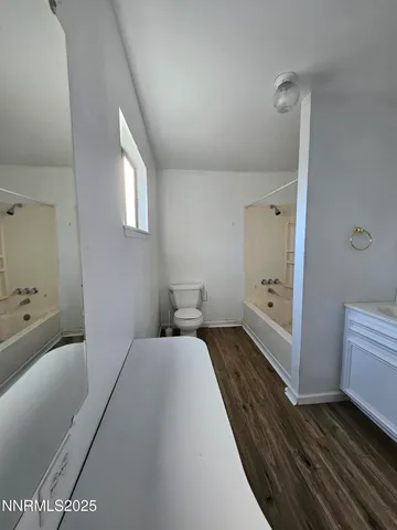 a view of a lake with couches and city view