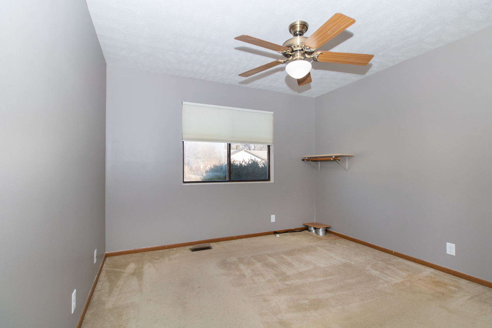 105 Churchill Road Normal, IL 61761 - Photo 16 of 24 an empty room with ceiling fan and window