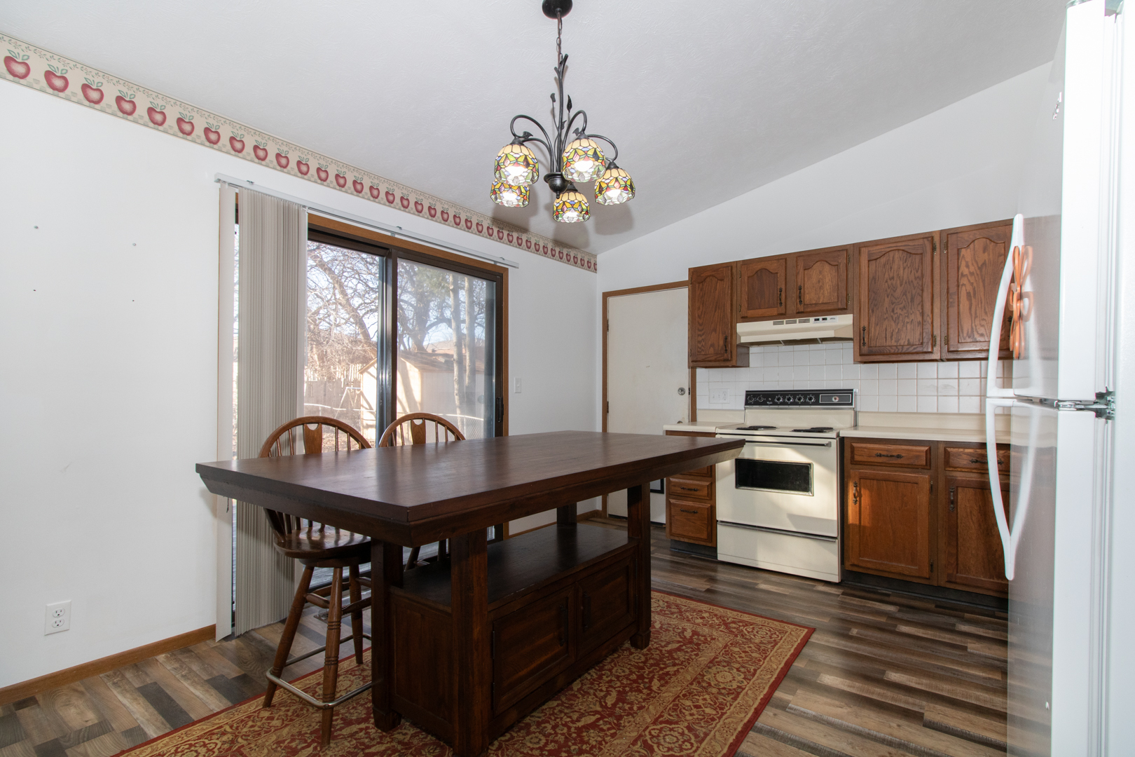 105 Churchill Road Normal, IL 61761 - Photo 5 of 24 a kitchen with stainless steel appliances kitchen island granite countertop a sink a stove and a refrigerator