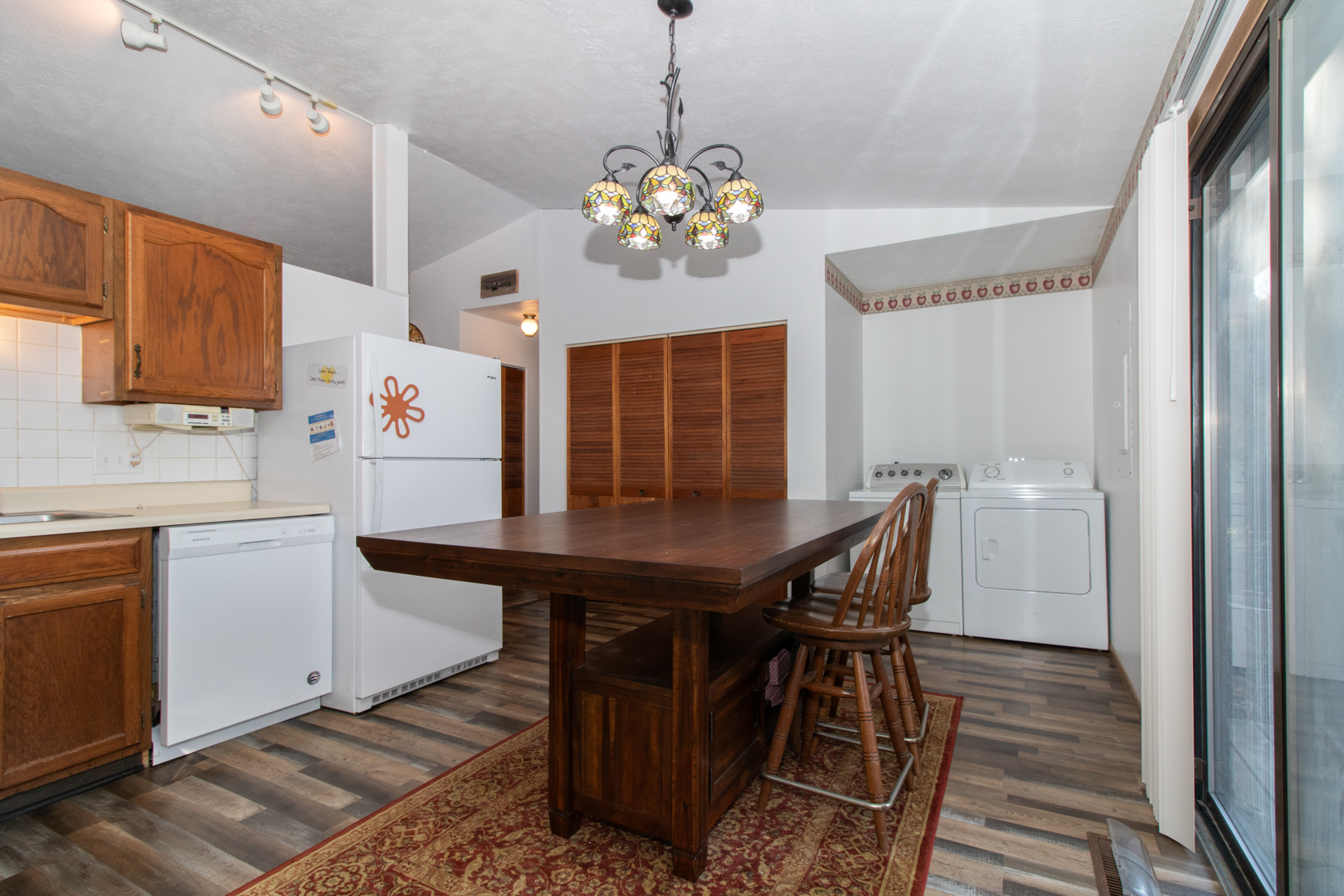 105 Churchill Road Normal, IL 61761 - Photo 7 of 24 a view of a dining room with furniture and wooden floor
