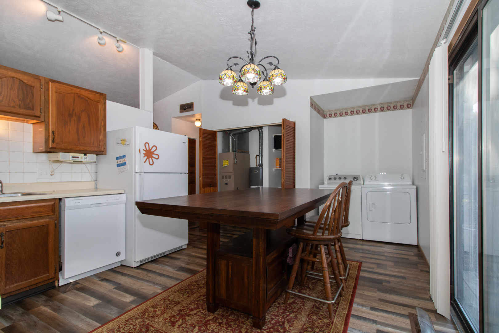 105 Churchill Road Normal, IL 61761 - Photo 9 of 24 a view of a dining room with furniture window and wooden floor