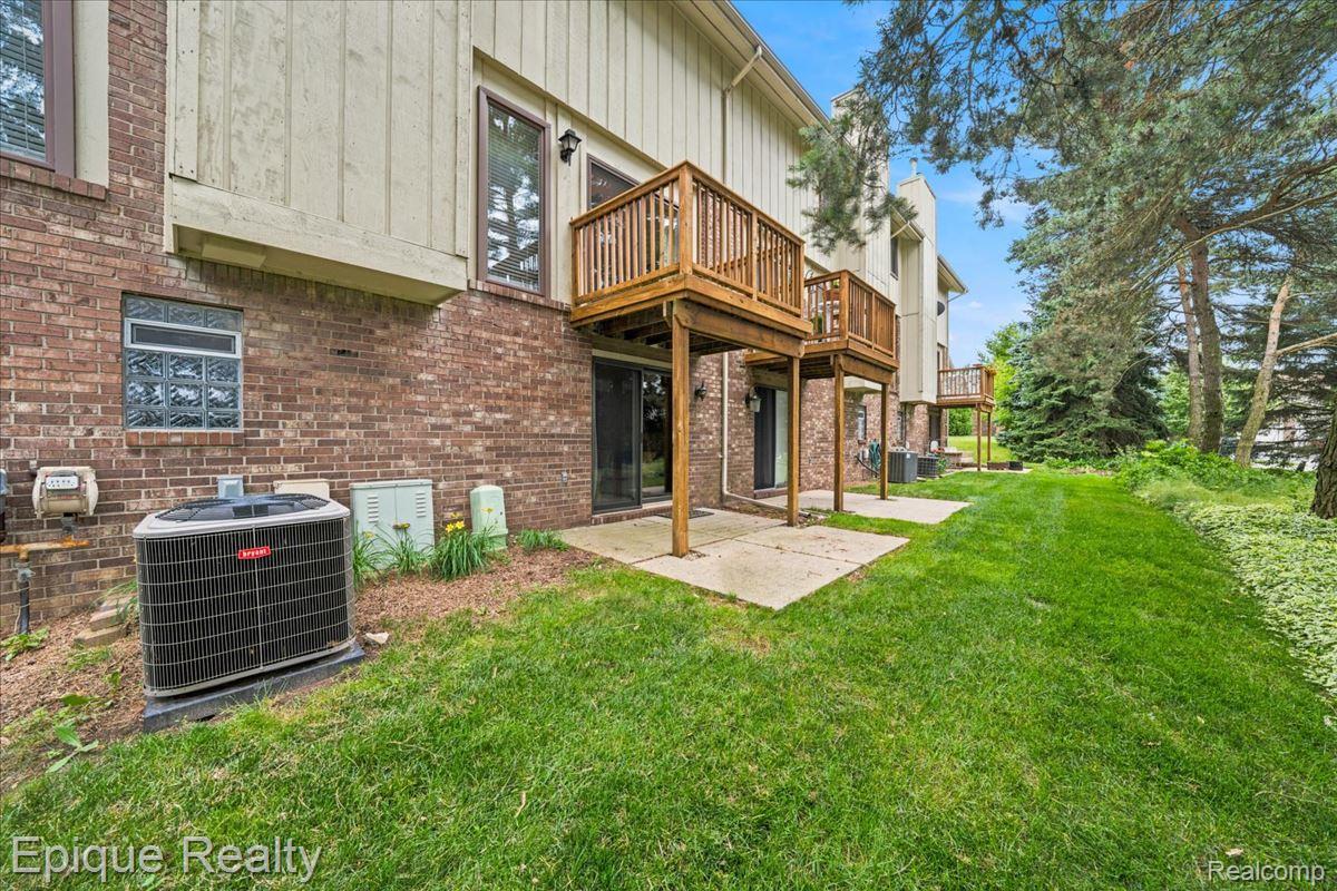 26 Kirks Court Rochester, MI 48309 - Photo 43 of 44 Brick exterior with multiple private wooden balconies