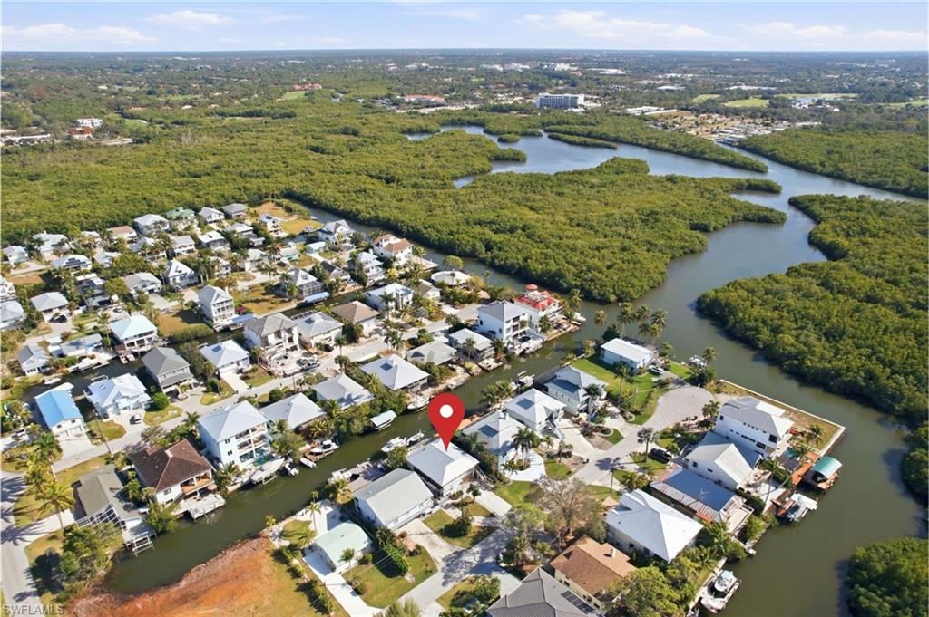 1286 Venetian Way Naples, FL 34110 - Photo 45 of 46 an aerial view of residential houses with outdoor space and river