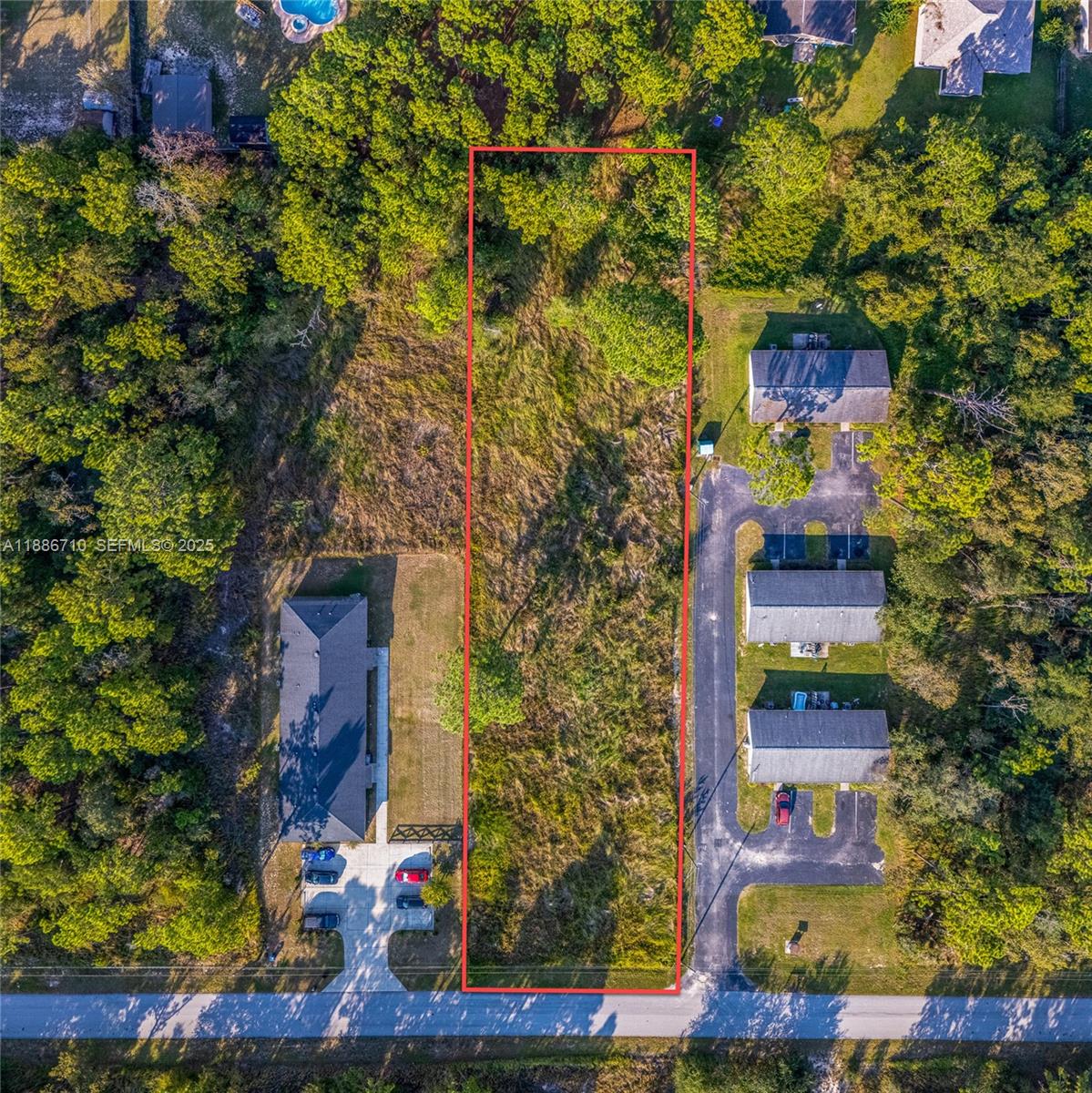 0 Midway Terrace Ocala, FL 34472 - Photo 5 of 8 an aerial view of a residential apartment building with a yard and potted plants