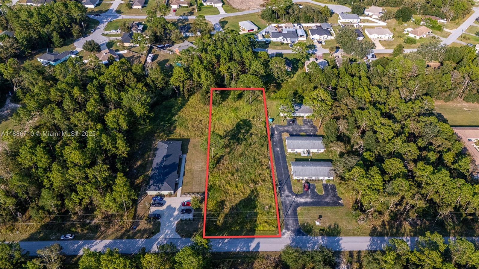 0 Midway Terrace Ocala, FL 34472 - Photo 7 of 8 an aerial view of multi story residential apartment building with yard