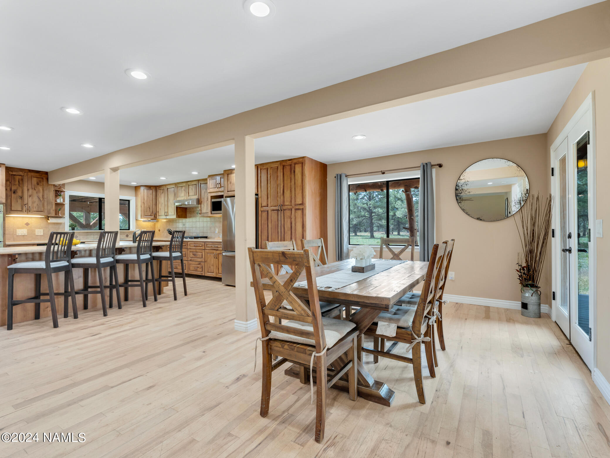 15312 Rabbit Brush Road Parks, AZ 86018 - Photo 13 of 59 a view of a dining room with furniture and wooden floor