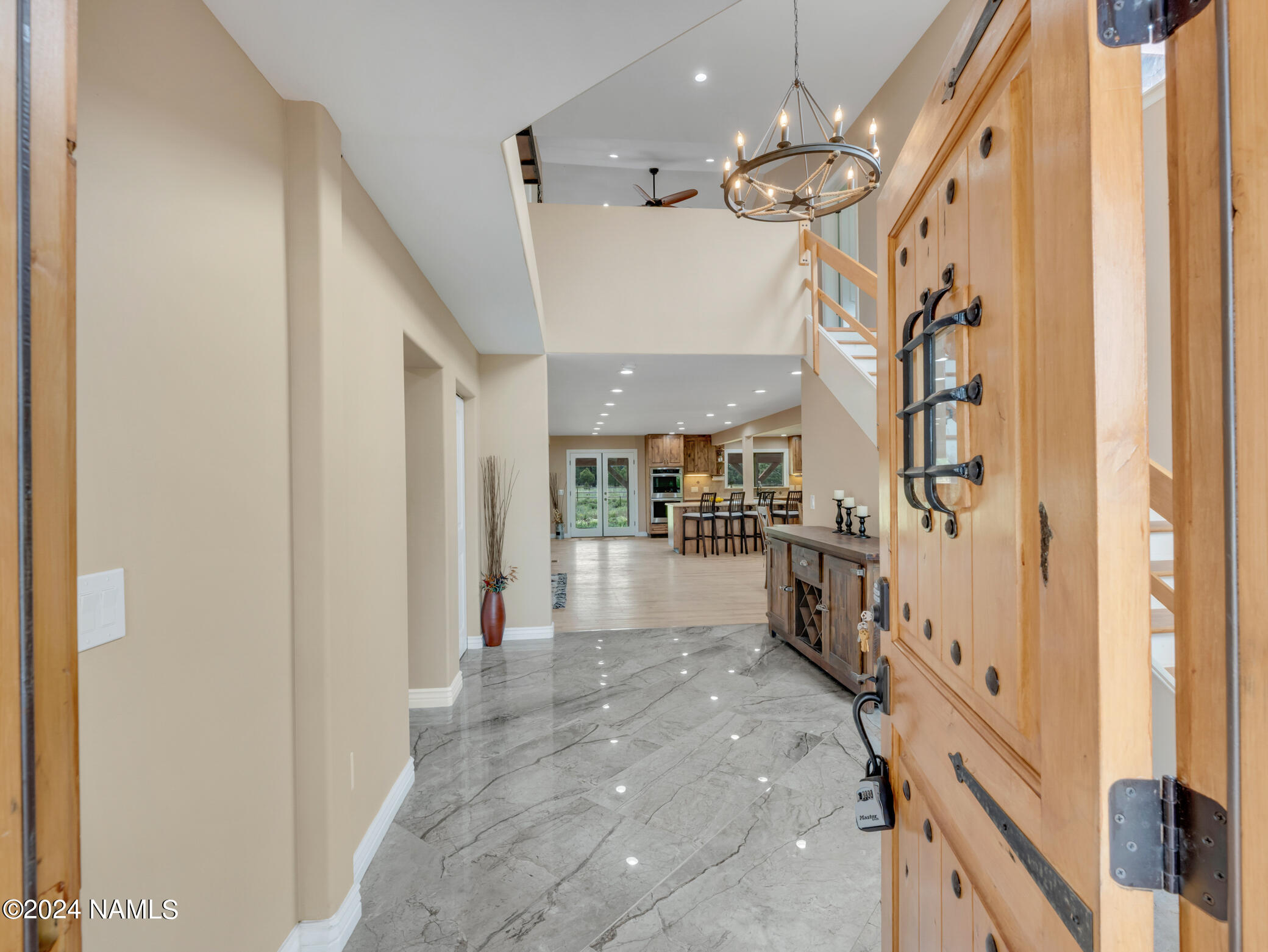 15312 Rabbit Brush Road Parks, AZ 86018 - Photo 2 of 59 a view of a hallway with furniture and a chandelier