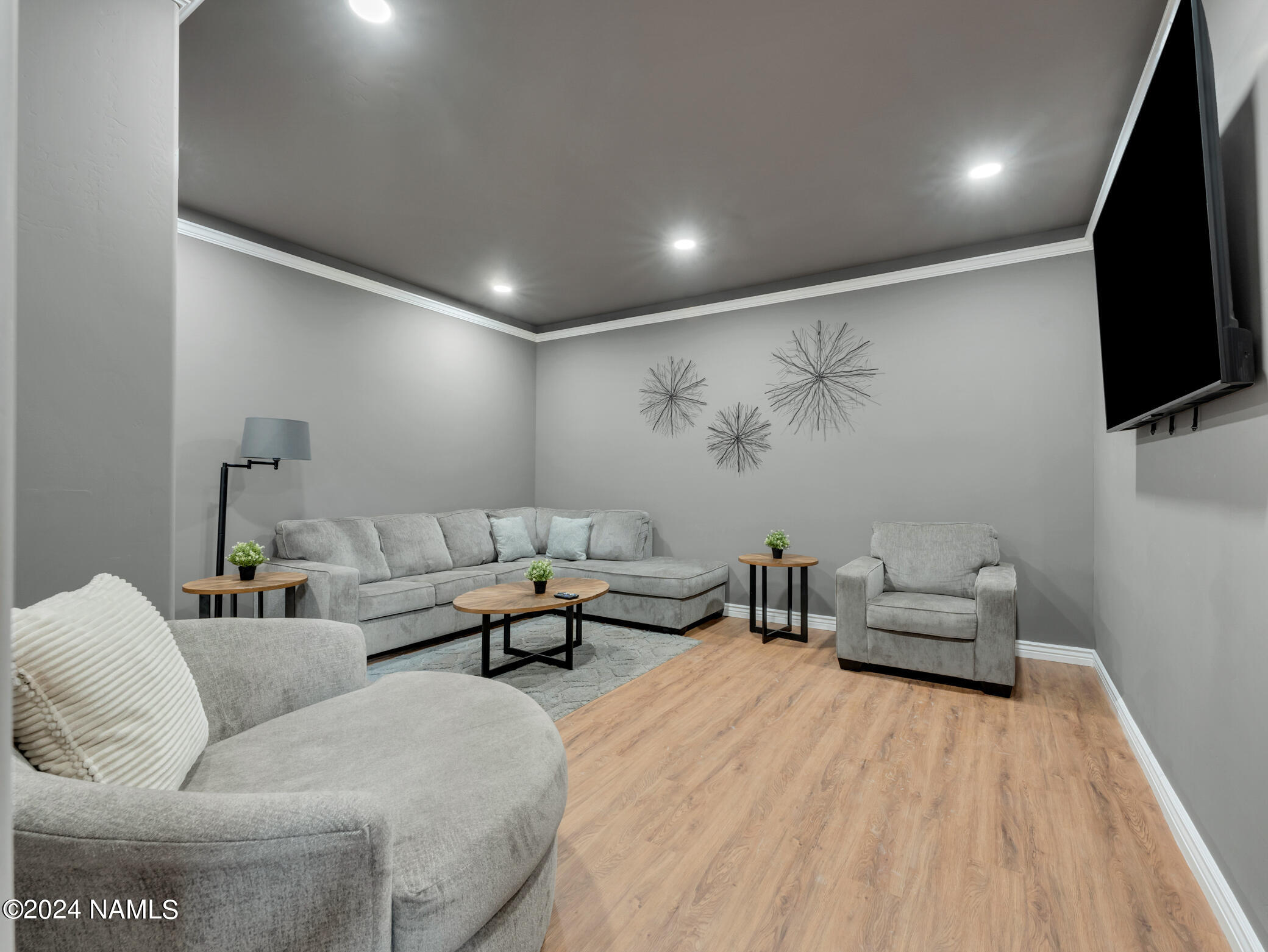 15312 Rabbit Brush Road Parks, AZ 86018 - Photo 24 of 59 a living room with furniture and a flat screen tv