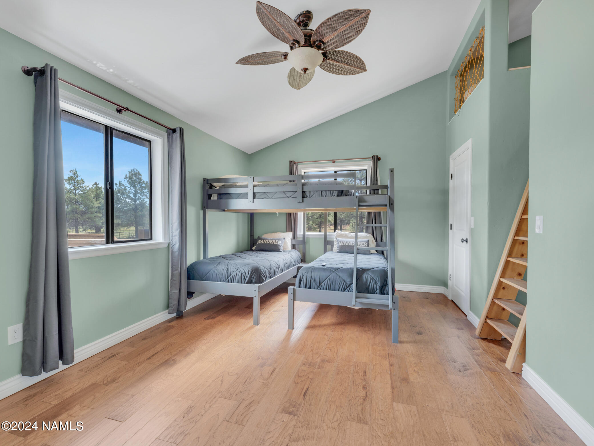 15312 Rabbit Brush Road Parks, AZ 86018 - Photo 30 of 59 a bedroom with furniture and a window