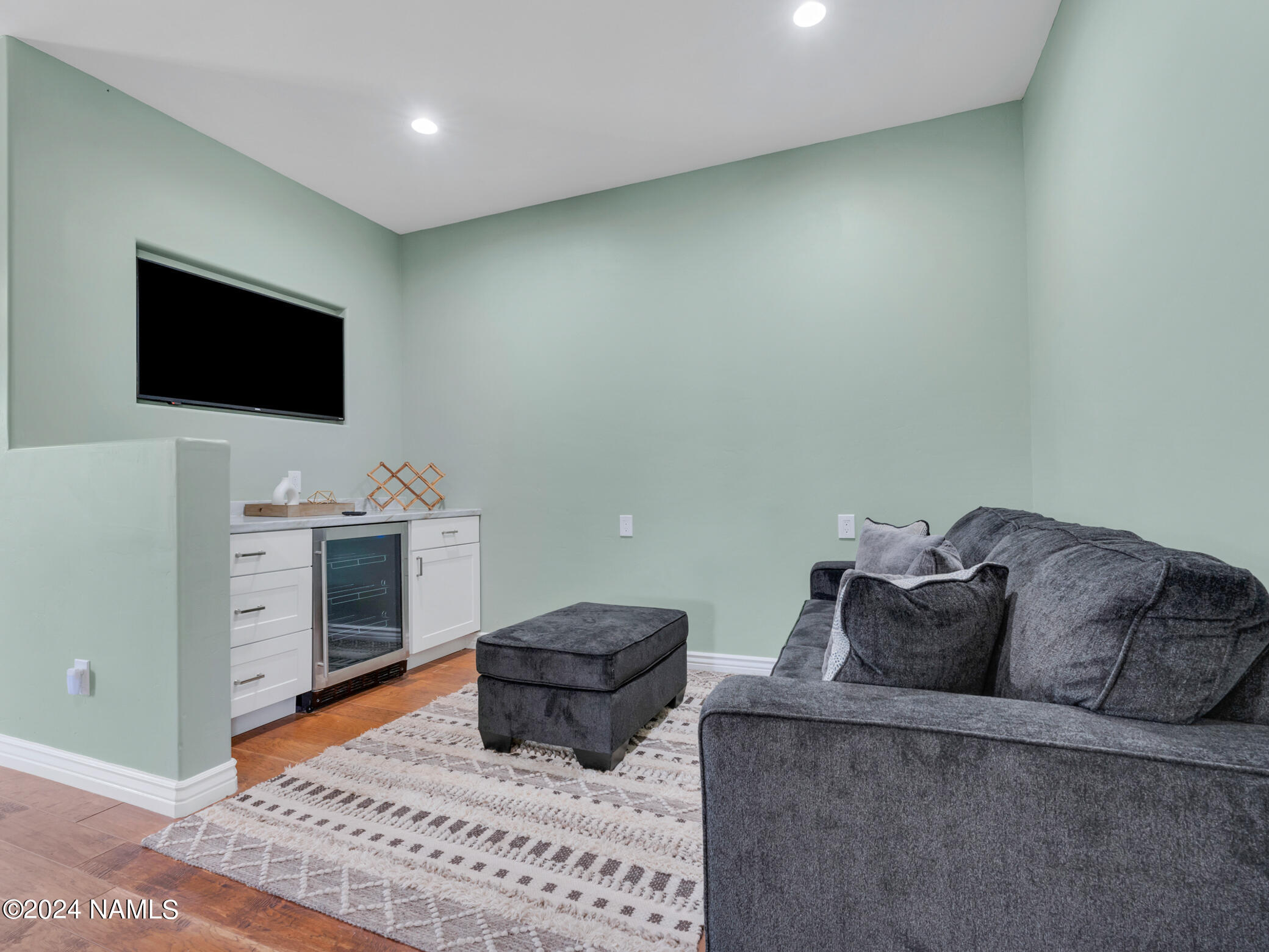 15312 Rabbit Brush Road Parks, AZ 86018 - Photo 35 of 59 a living room with furniture and a flat screen tv