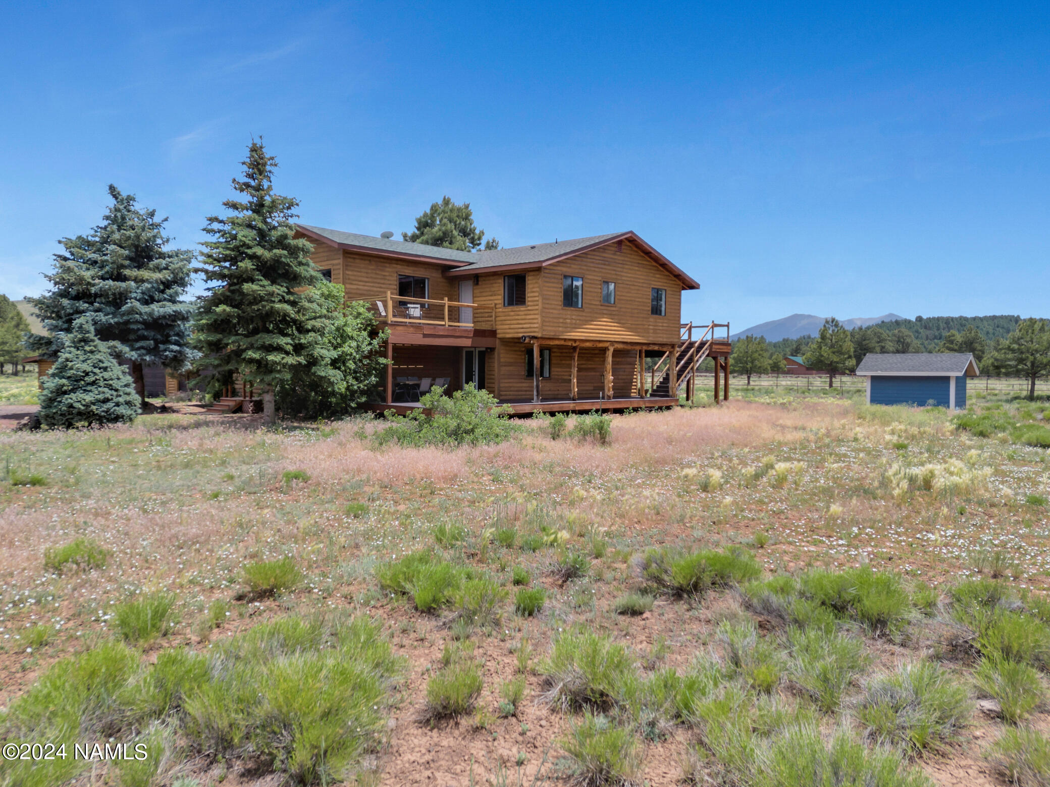 15312 Rabbit Brush Road Parks, AZ 86018 - Photo 5 of 59 a view of a house with a yard