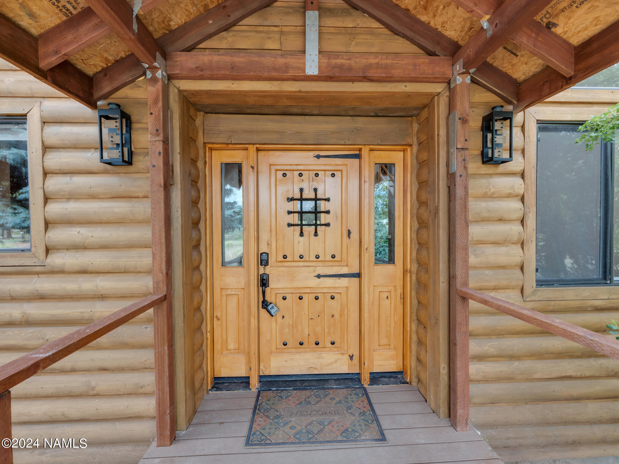 15312 Rabbit Brush Road Parks, AZ 86018 - Photo 7 of 59 a view of a entryway door of the house