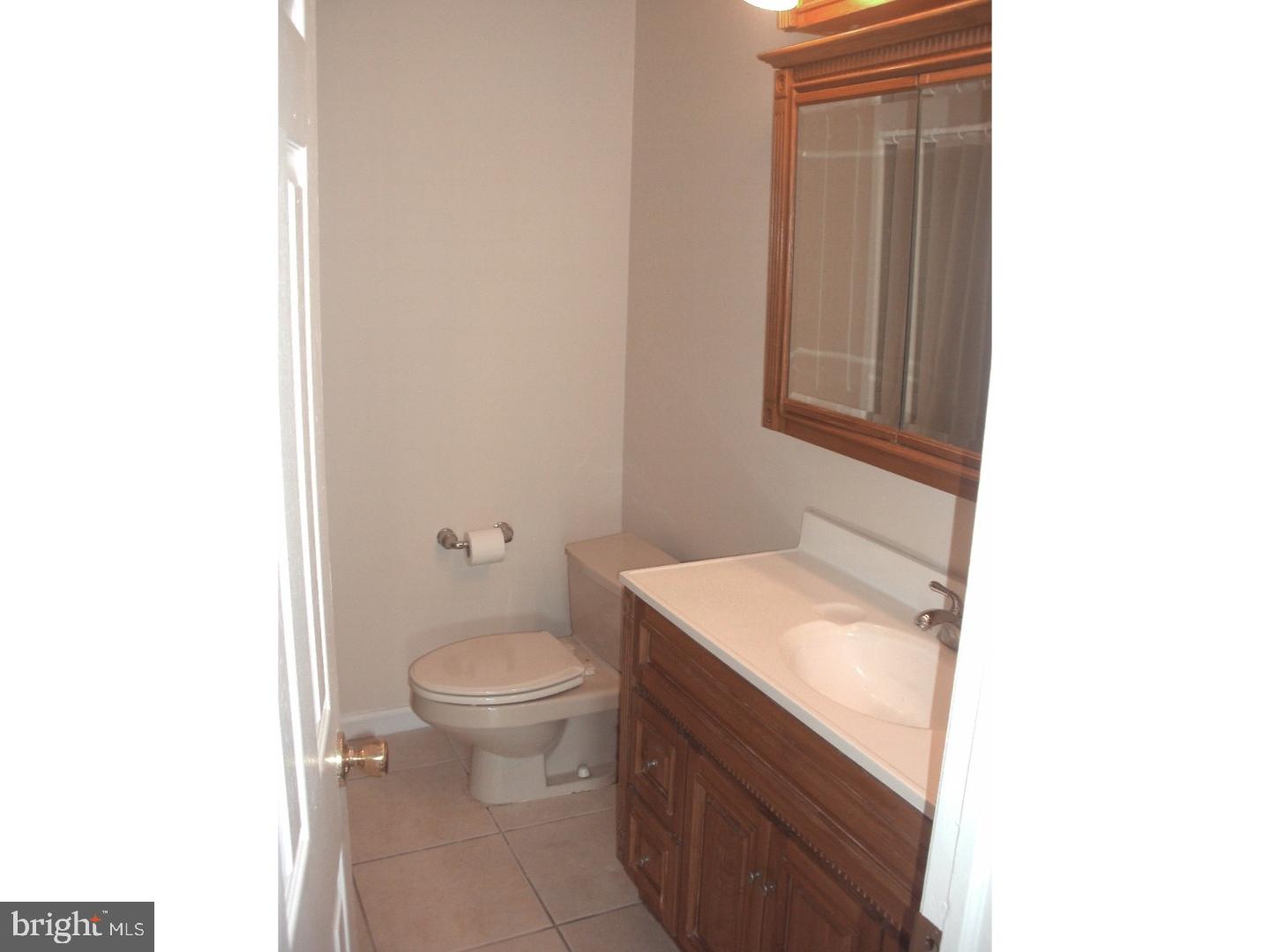 232 Oakfield Drive Newark, DE 19713 - Photo 13 of 14 a bathroom with a granite countertop toilet and a sink