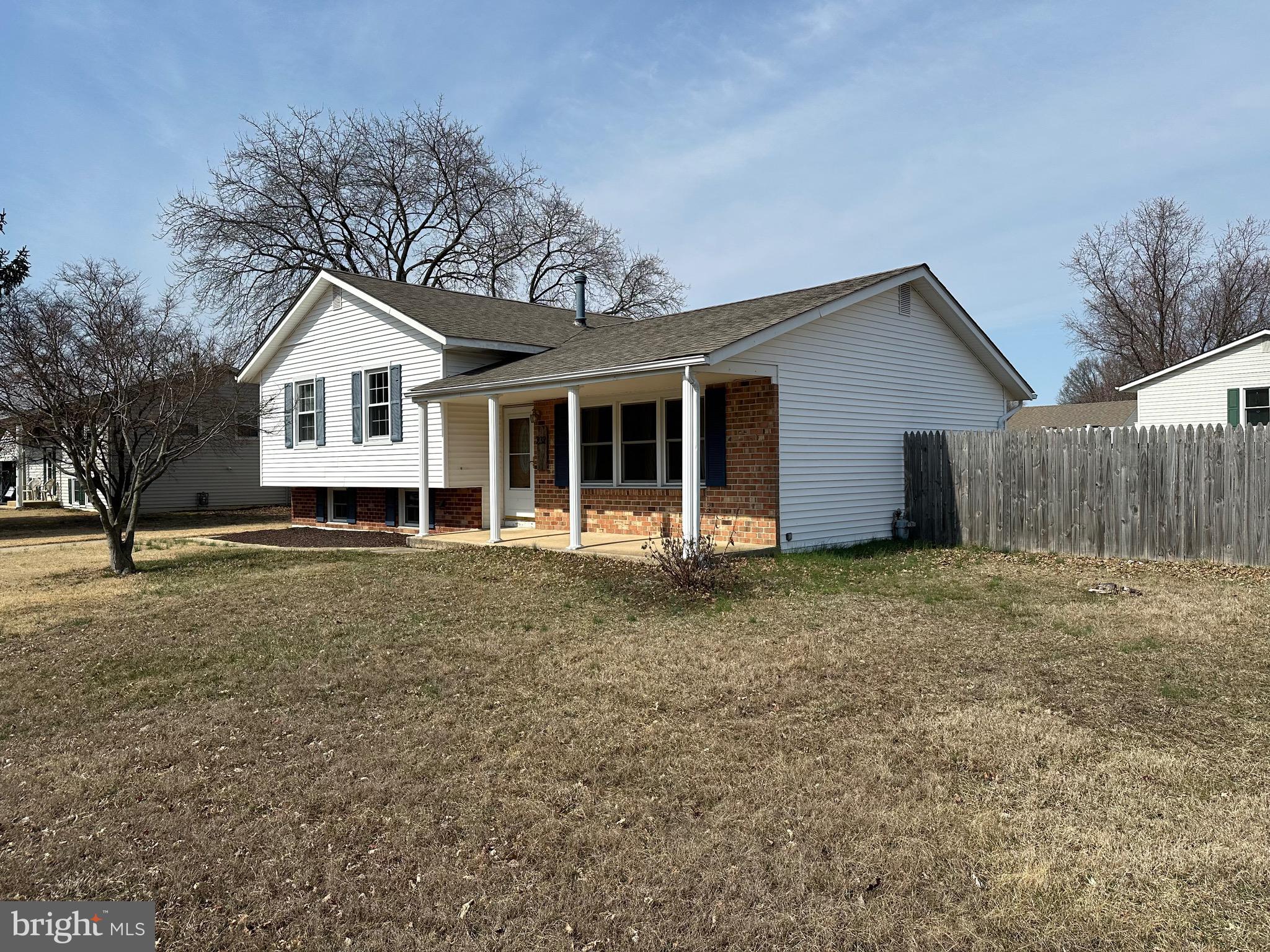 232 Oakfield Drive Newark, DE 19713 - Photo 2 of 14 a house with trees in the background