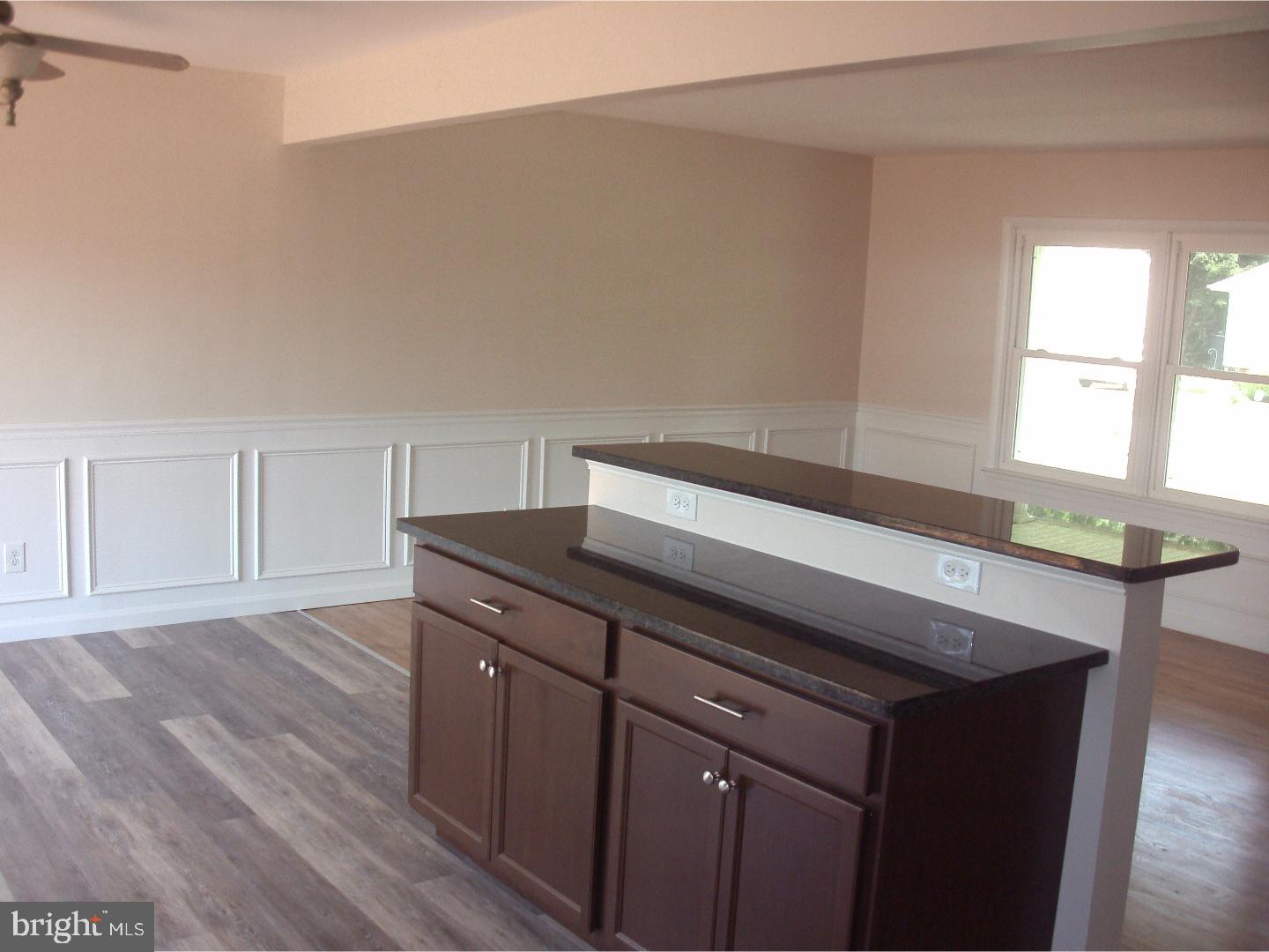 232 Oakfield Drive Newark, DE 19713 - Photo 5 of 14 a kitchen with a sink cabinets and wooden floor