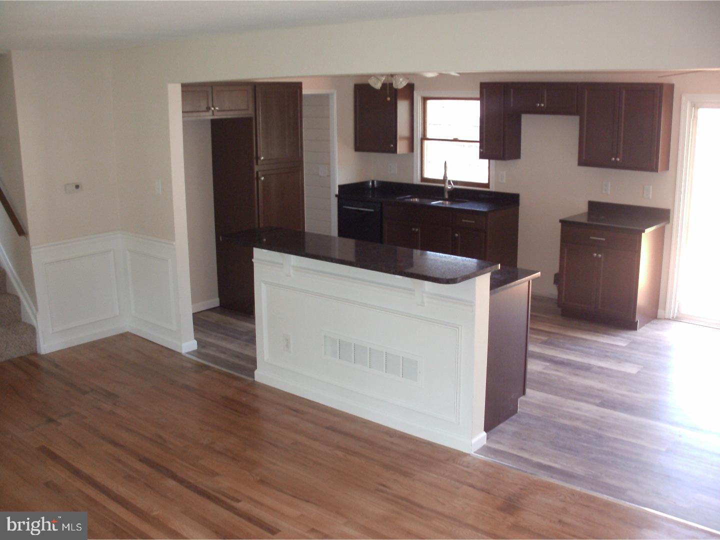 232 Oakfield Drive Newark, DE 19713 - Photo 6 of 14 a kitchen with a stove and wooden floor