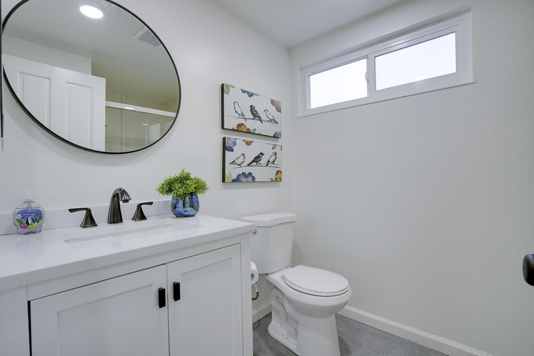 2576 Toltec Circle San Ramon, CA 94583 - Photo 13 of 37 a bathroom with a sink a mirror and a toilet