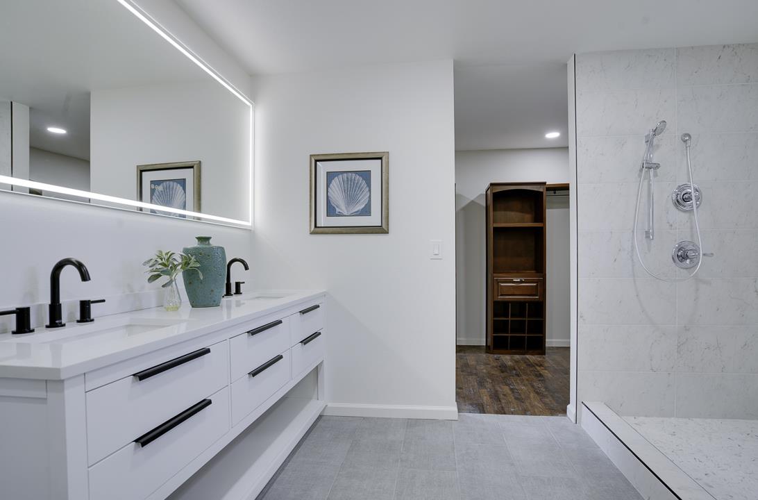 2576 Toltec Circle San Ramon, CA 94583 - Photo 21 of 37 a bathroom with a double vanity sink a mirror and shower