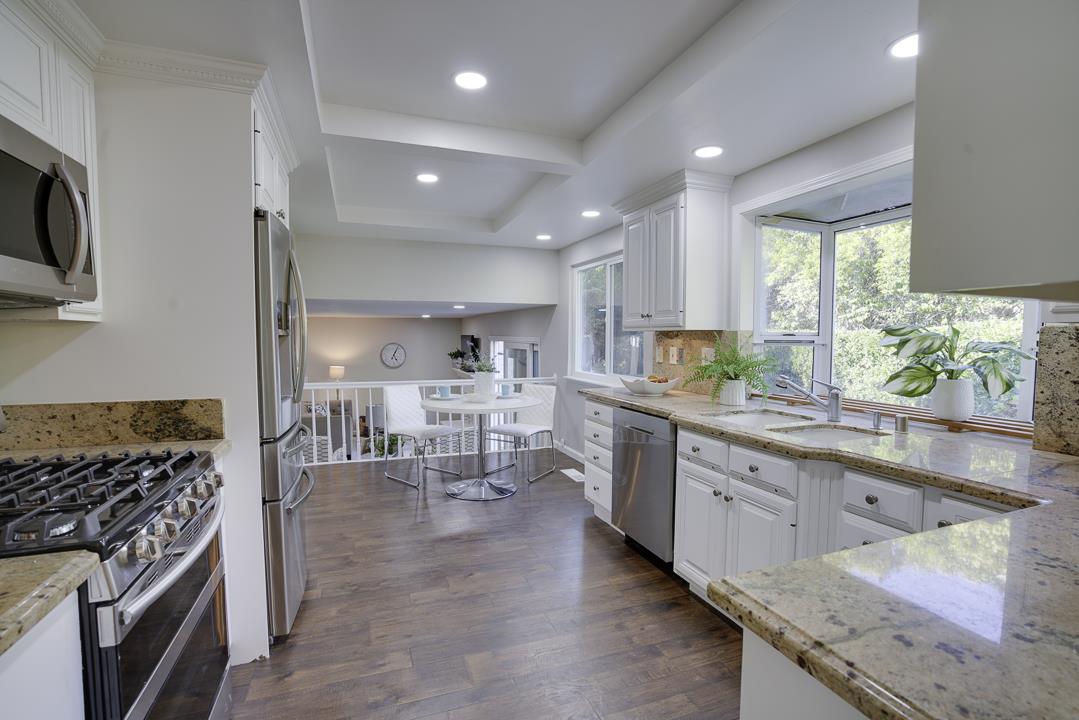 2576 Toltec Circle San Ramon, CA 94583 - Photo 8 of 37 a kitchen with counter top space cabinets and stainless steel appliances