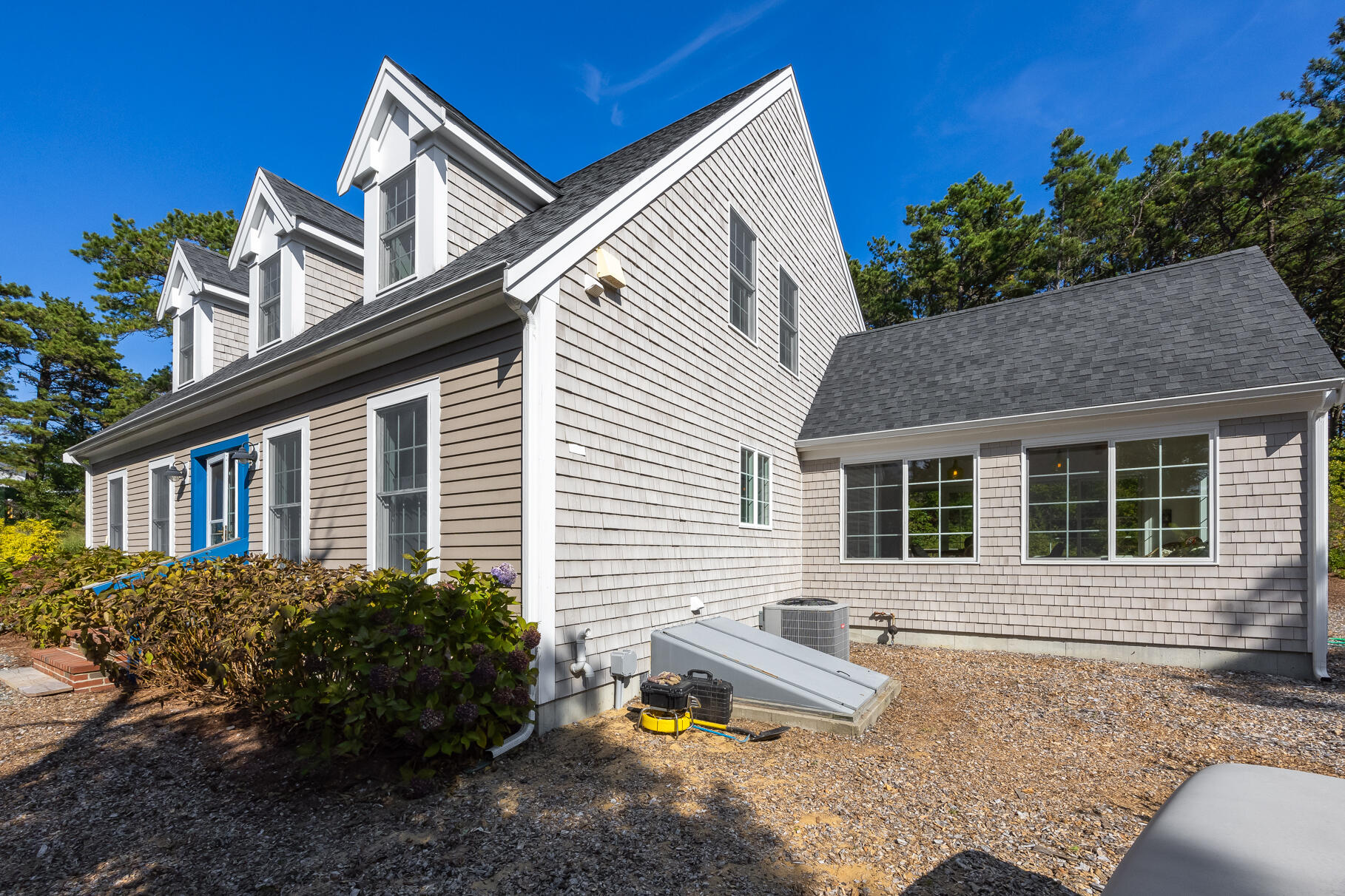 105 High Meadow Road Wellfleet, MA 02667 - Photo 11 of 52 a front view of a house with garden