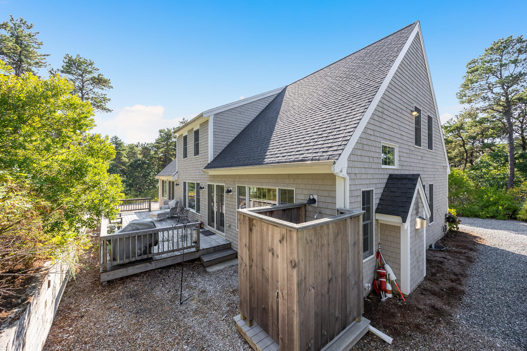 105 High Meadow Road Wellfleet, MA 02667 - Photo 2 of 52 a view of a house with backyard and sitting area
