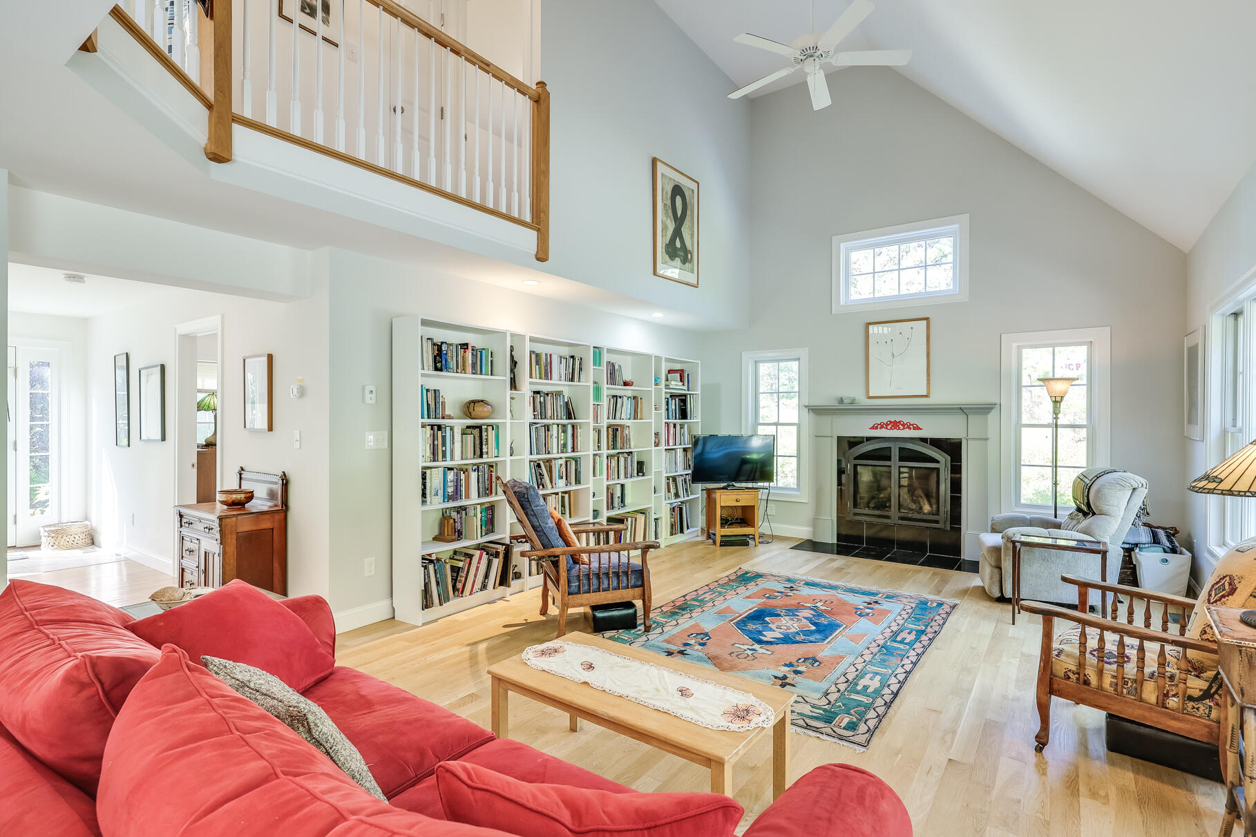105 High Meadow Road Wellfleet, MA 02667 - Photo 21 of 52 a living room with furniture fireplace and a table