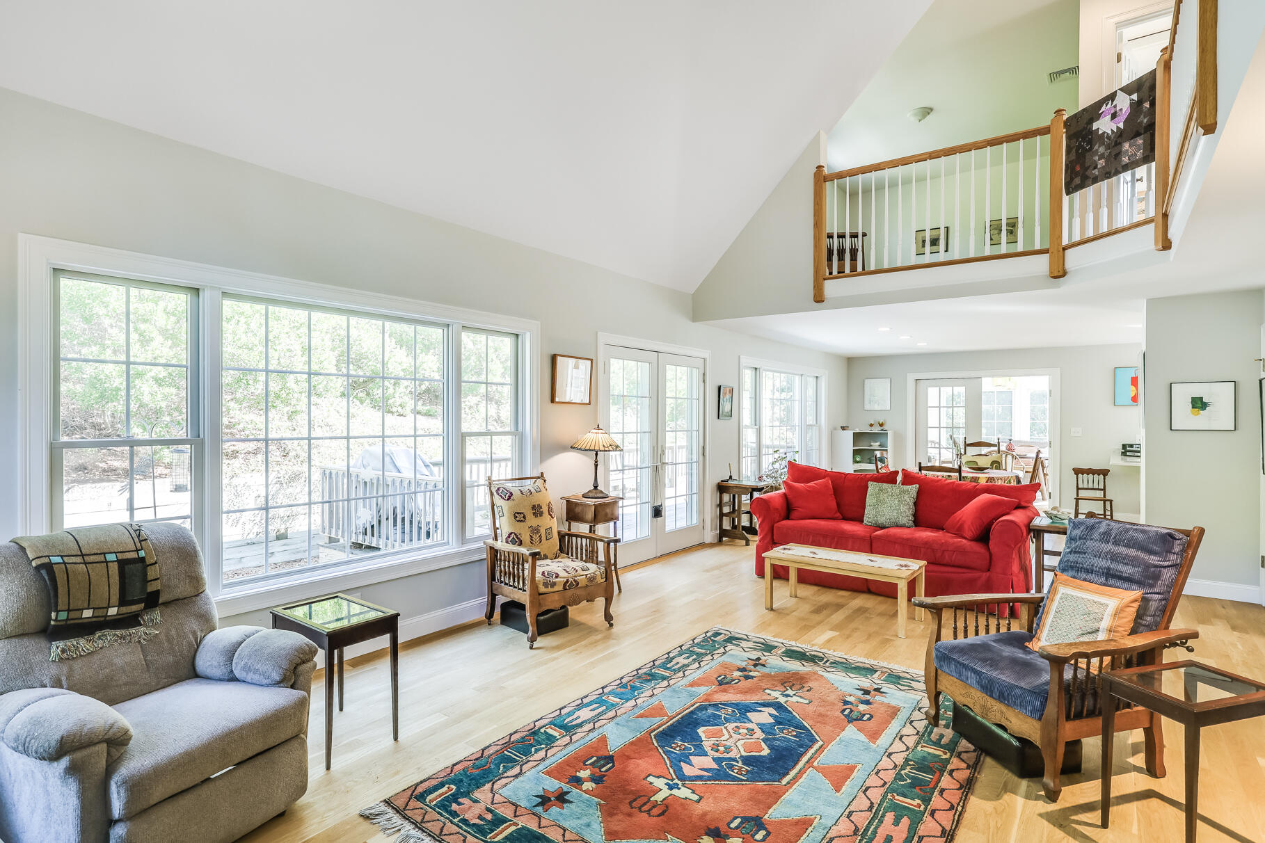 105 High Meadow Road Wellfleet, MA 02667 - Photo 23 of 52 a living room with furniture a rug and a floor to ceiling fan