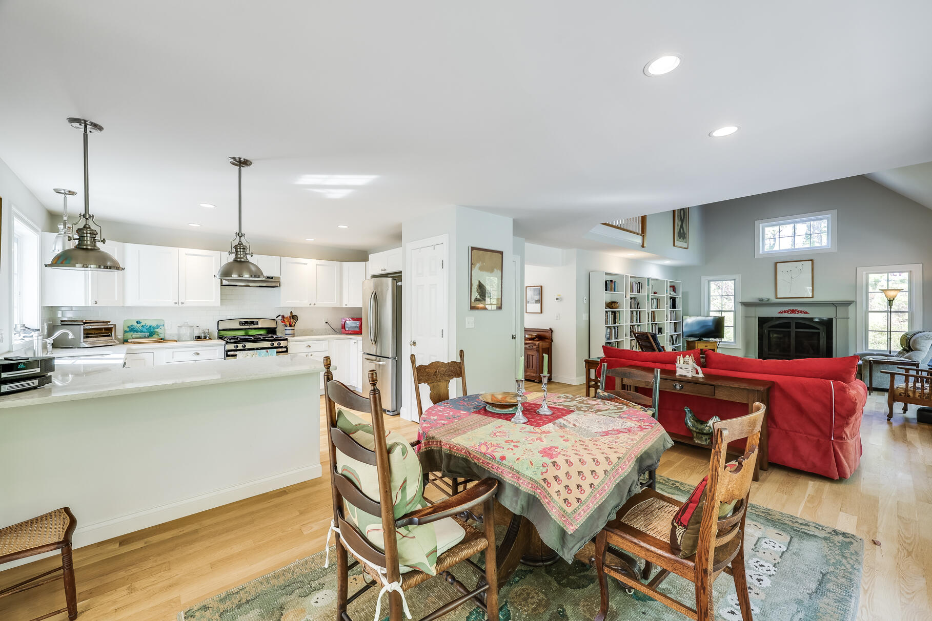 105 High Meadow Road Wellfleet, MA 02667 - Photo 30 of 52 a dining room with furniture a window and kitchen view