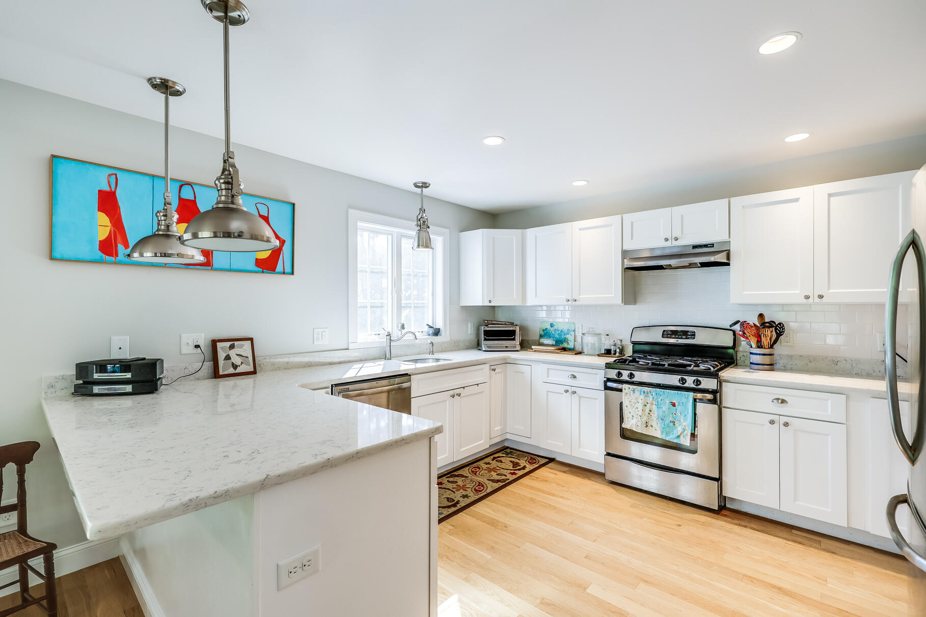 105 High Meadow Road Wellfleet, MA 02667 - Photo 33 of 52 a kitchen that has a lot of cabinets in it with wooden floor