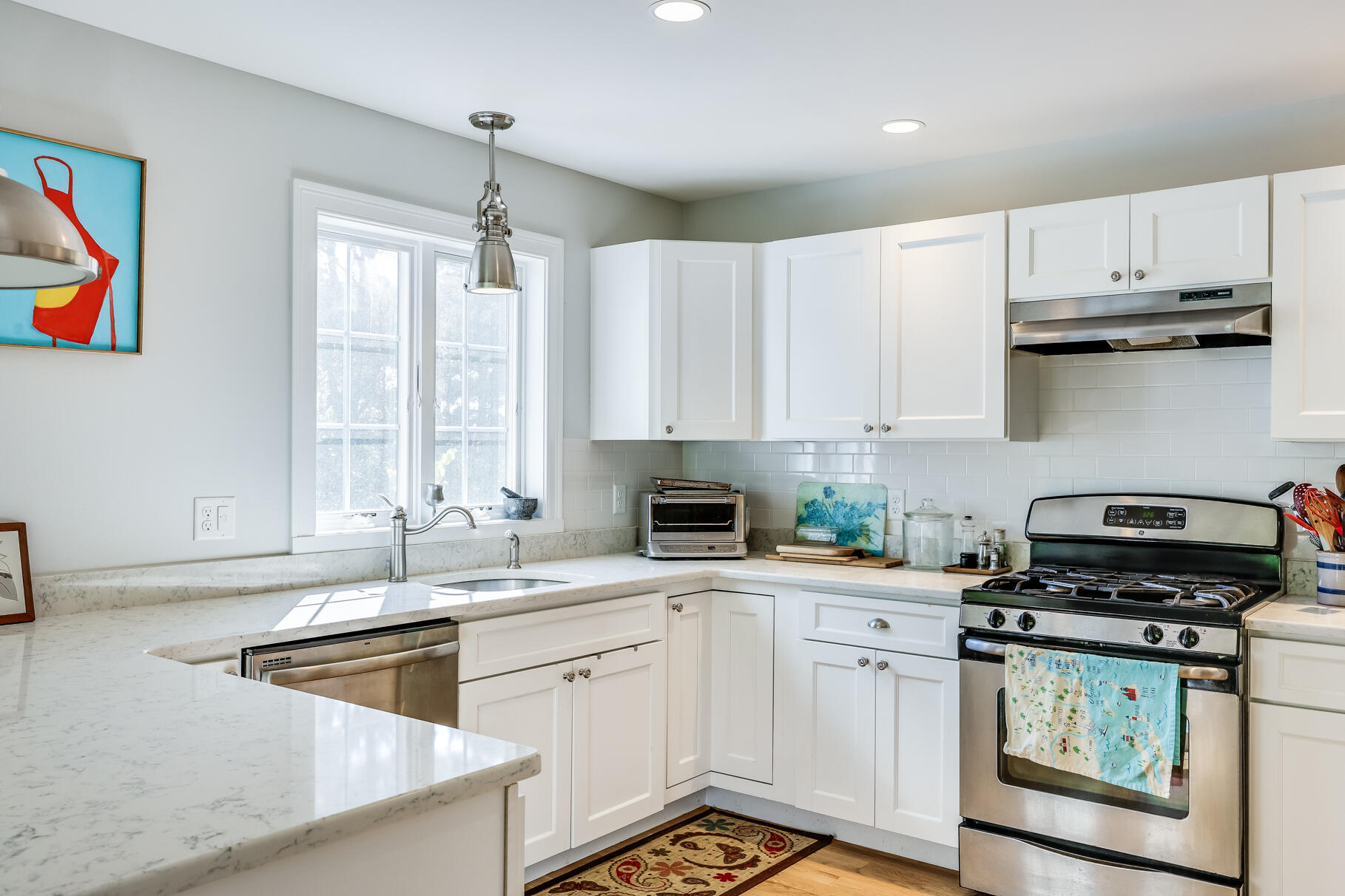 105 High Meadow Road Wellfleet, MA 02667 - Photo 34 of 52 a kitchen with stainless steel appliances granite countertop a sink stove and cabinets