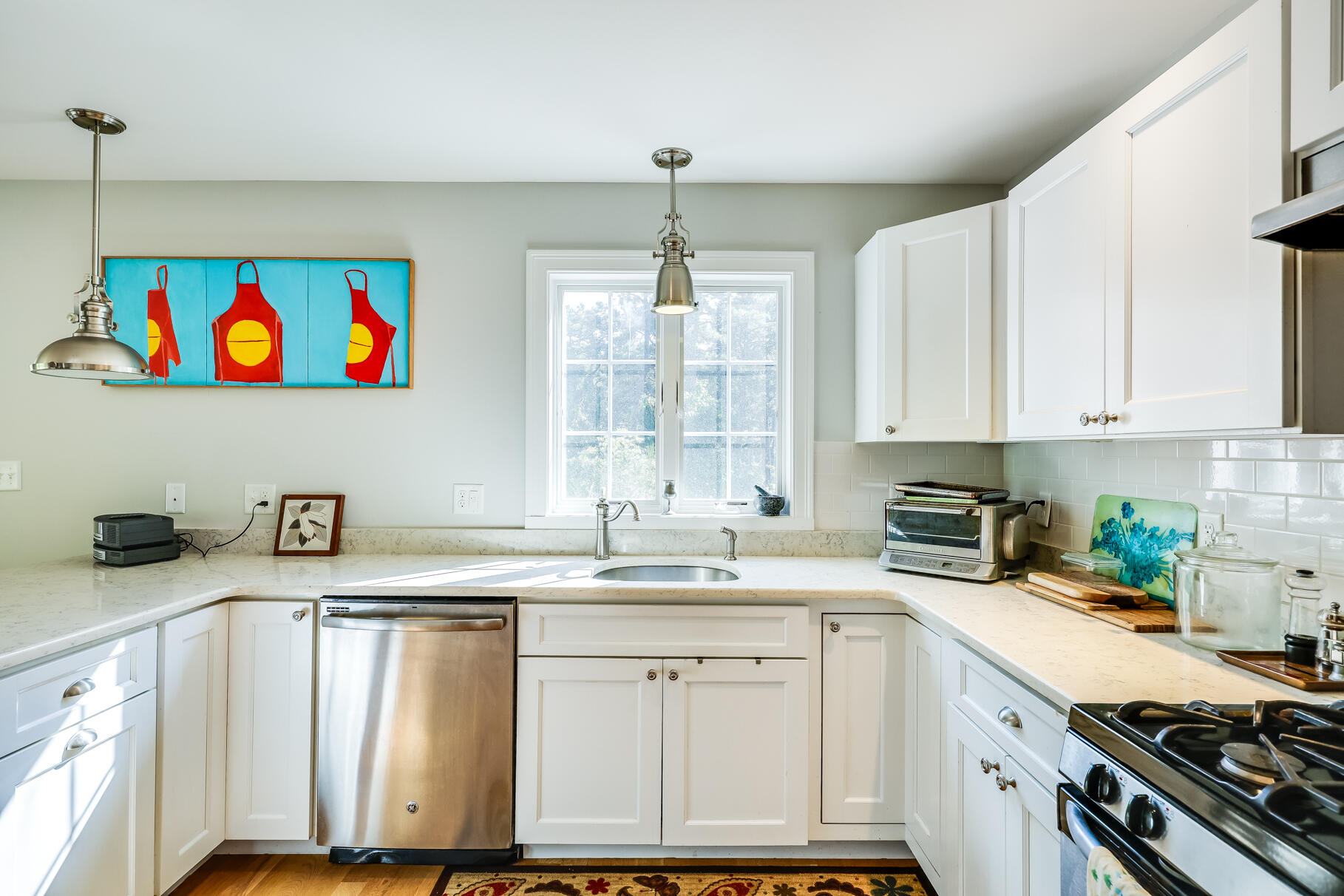 105 High Meadow Road Wellfleet, MA 02667 - Photo 35 of 52 a kitchen with granite countertop a sink stainless steel appliances and cabinets