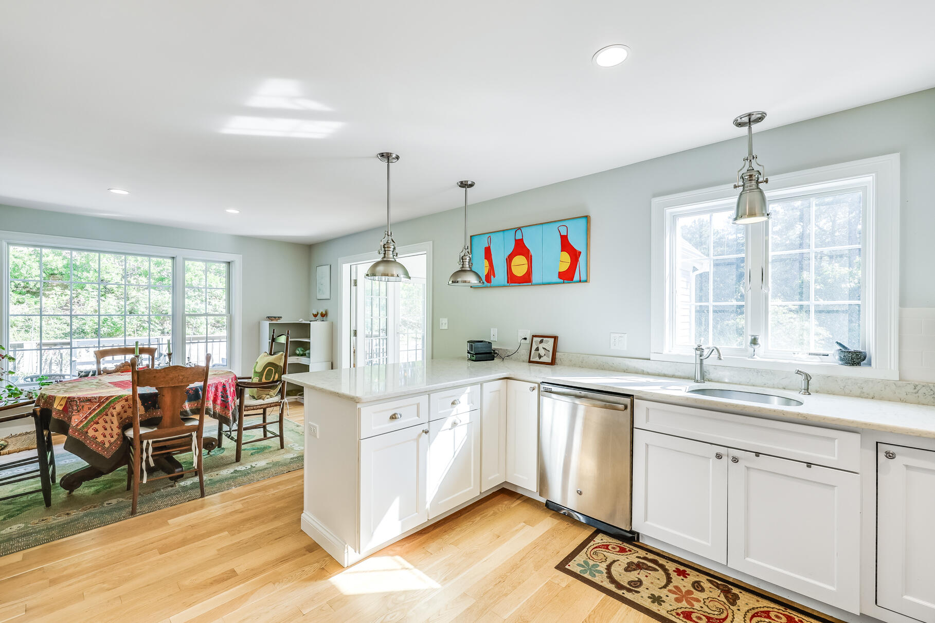 105 High Meadow Road Wellfleet, MA 02667 - Photo 36 of 52 a kitchen that has a lot of cabinets a sink and appliances in it