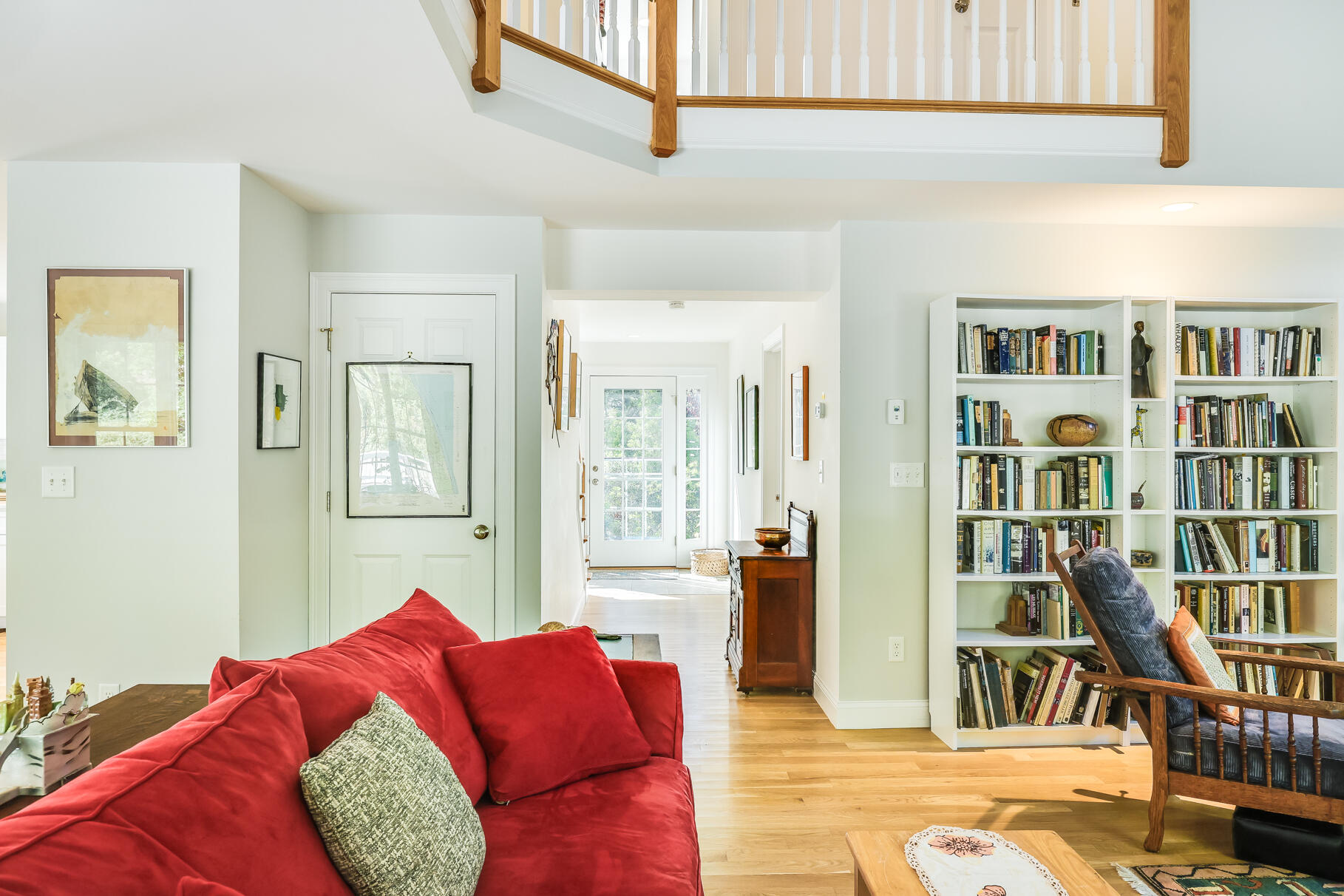 105 High Meadow Road Wellfleet, MA 02667 - Photo 39 of 52 a living room with furniture cabinets and a rug
