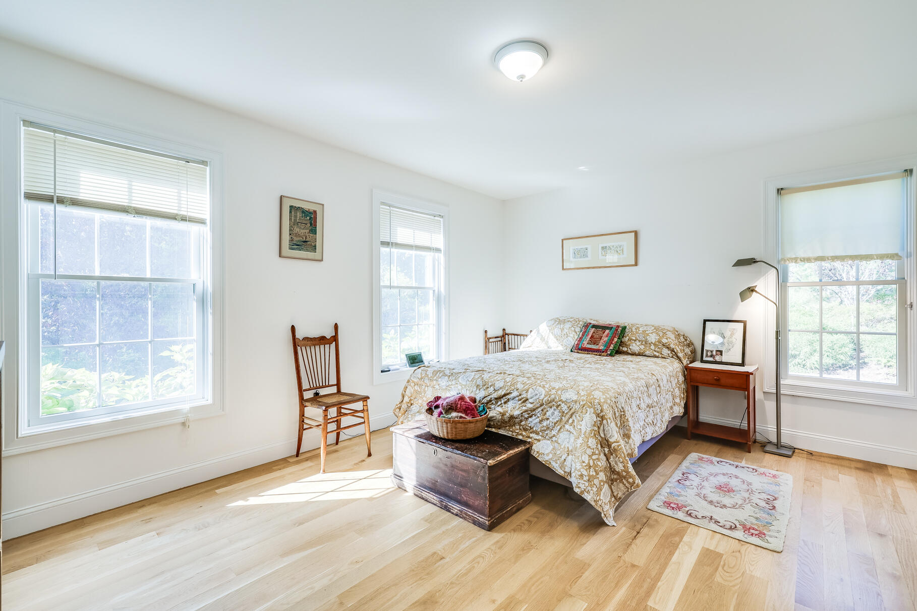 105 High Meadow Road Wellfleet, MA 02667 - Photo 41 of 52 a bedroom with a bed and wooden floor