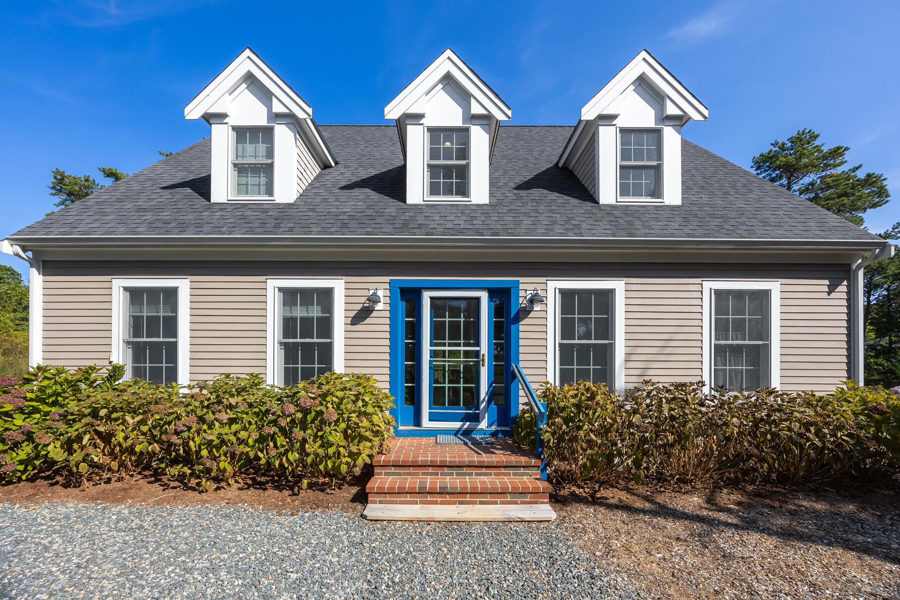 105 High Meadow Road Wellfleet, MA 02667 - Photo 5 of 52 a front view of house with yard and green space