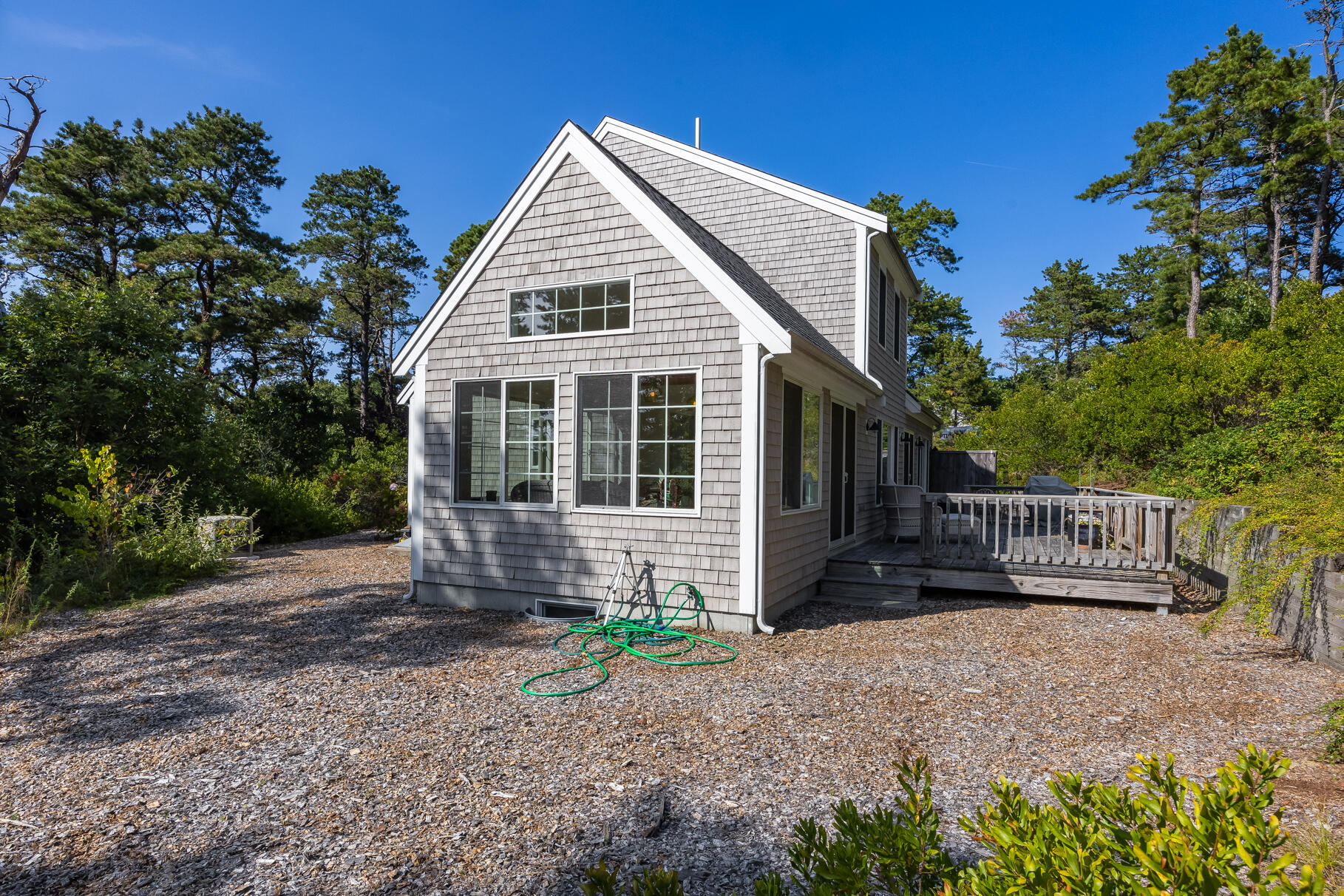 105 High Meadow Road Wellfleet, MA 02667 - Photo 8 of 52 a front view of a house with garden