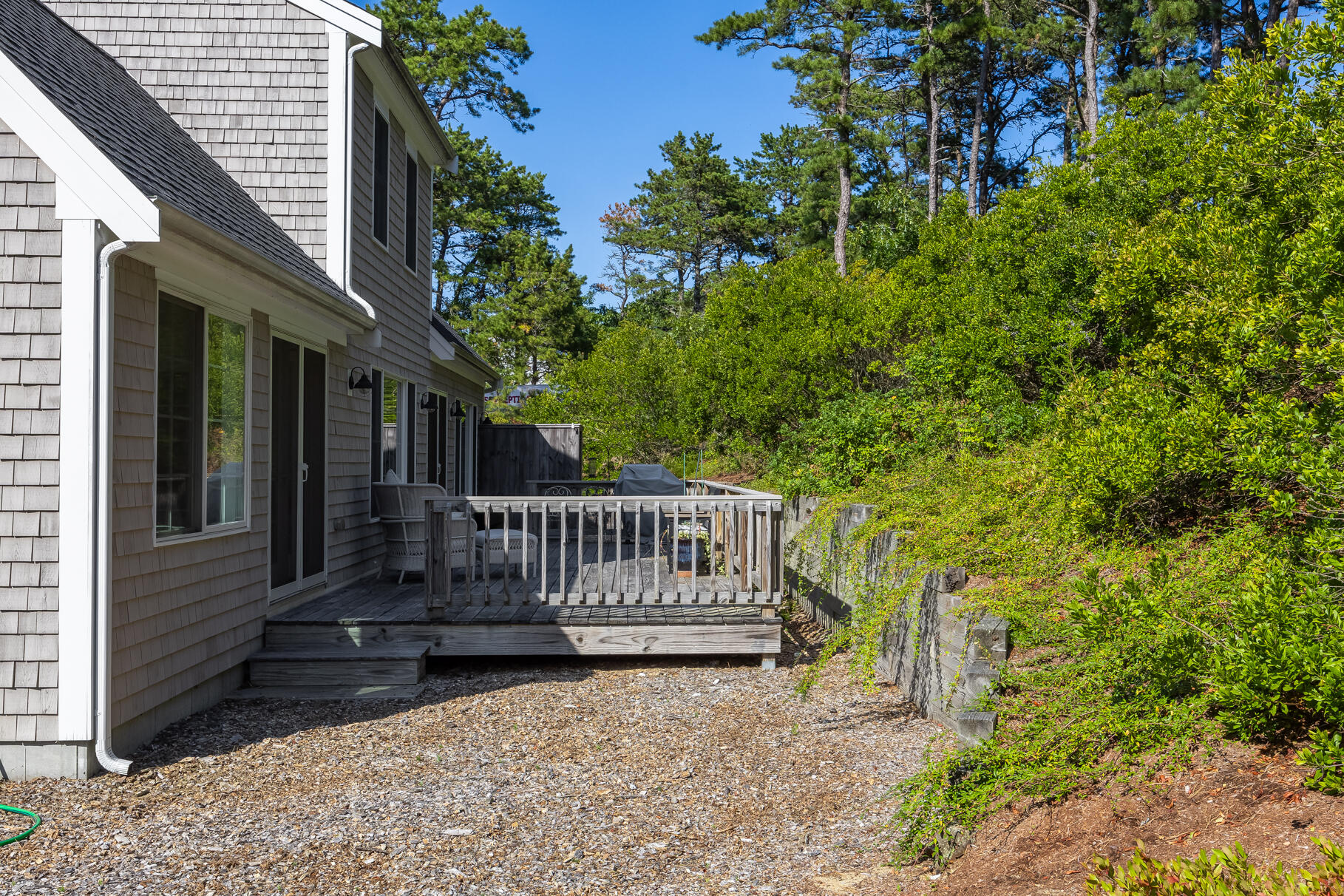 105 High Meadow Road Wellfleet, MA 02667 - Photo 9 of 52 a view of bench in front of a house